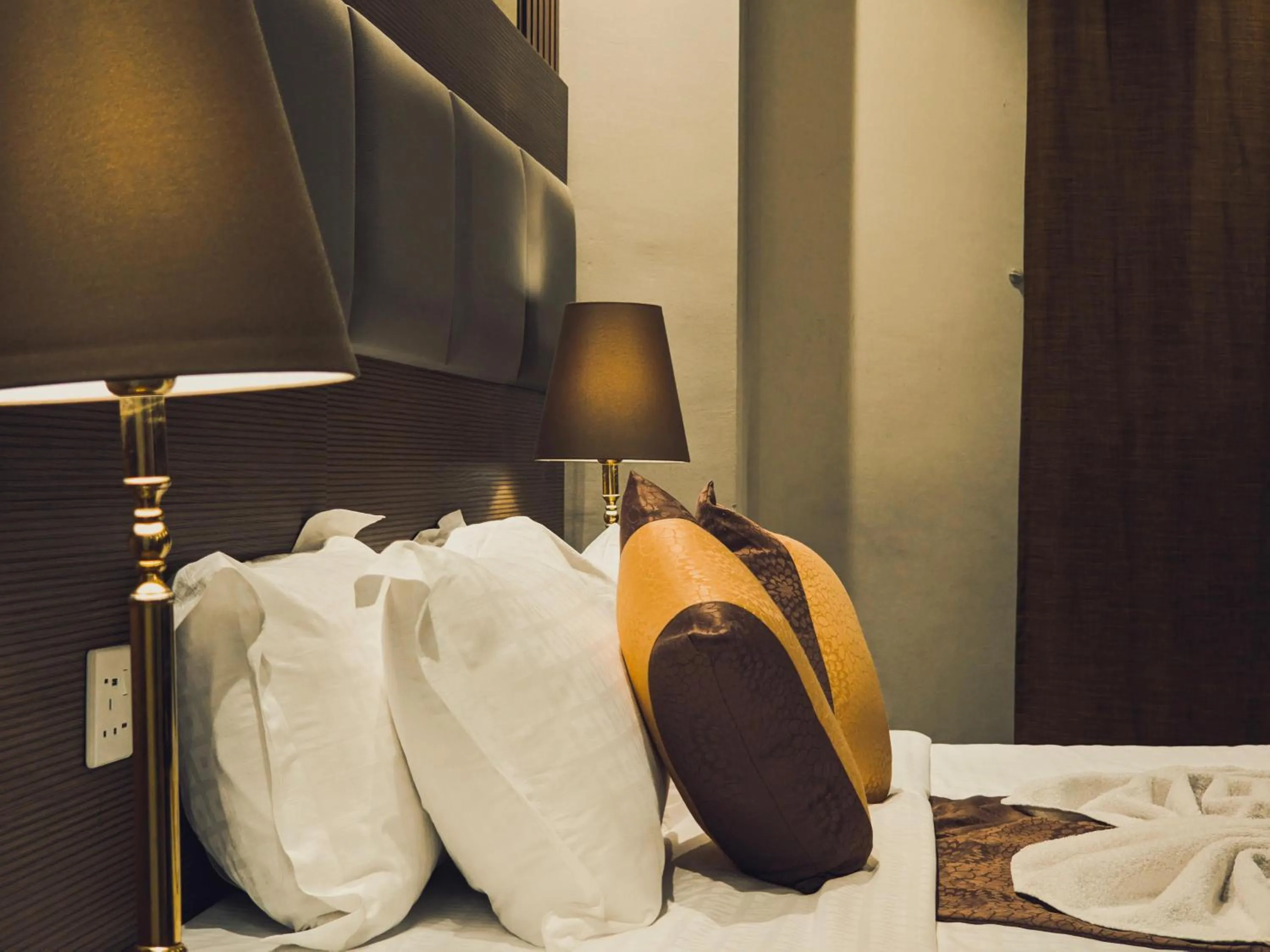 Bed in Al Ansar Palace Golden Tulip Hotel