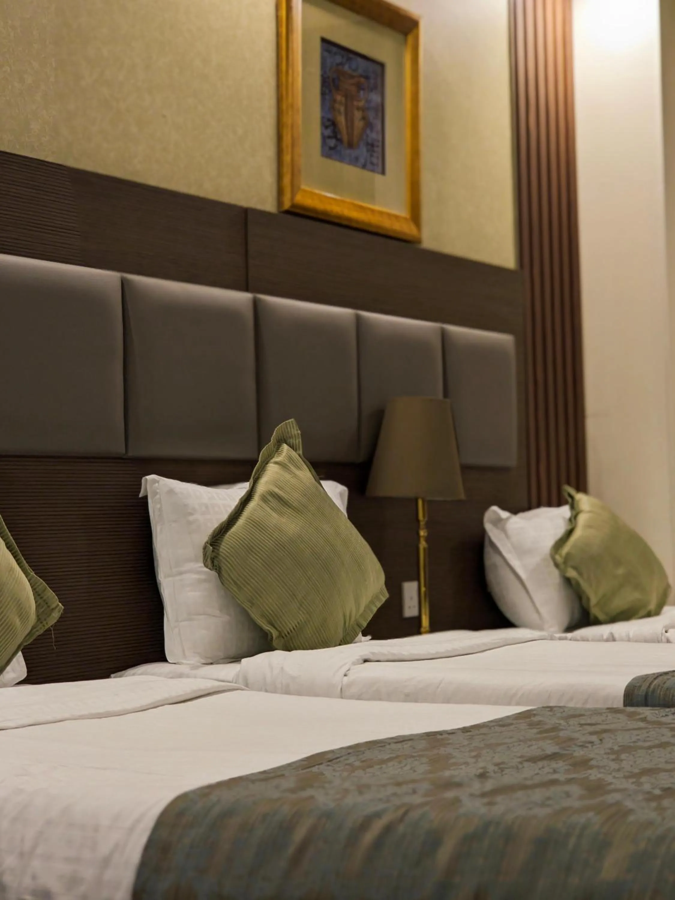 Bed in Al Ansar Palace Golden Tulip Hotel