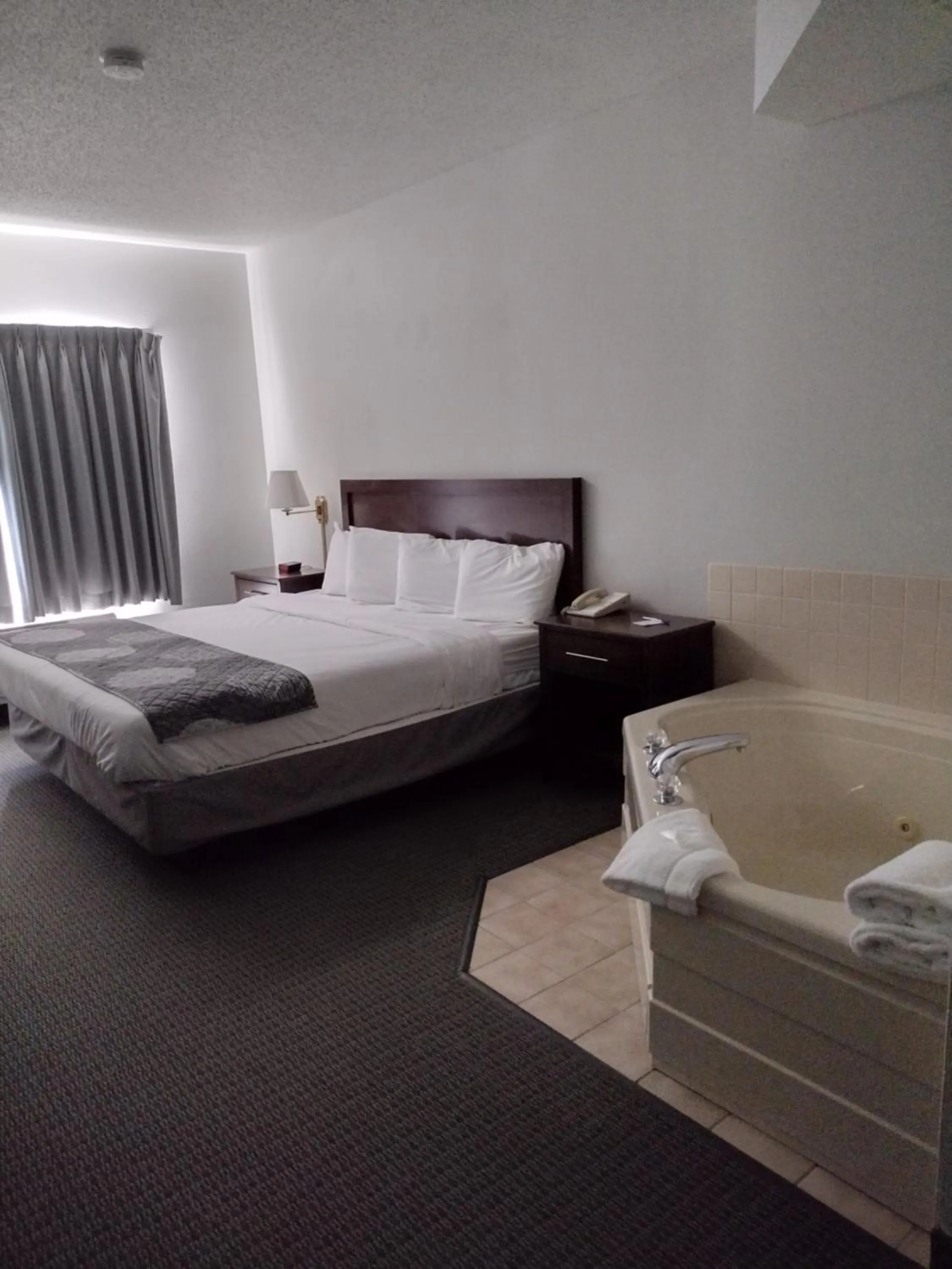 Bed in GrandStay Hotel & Suites Hastings