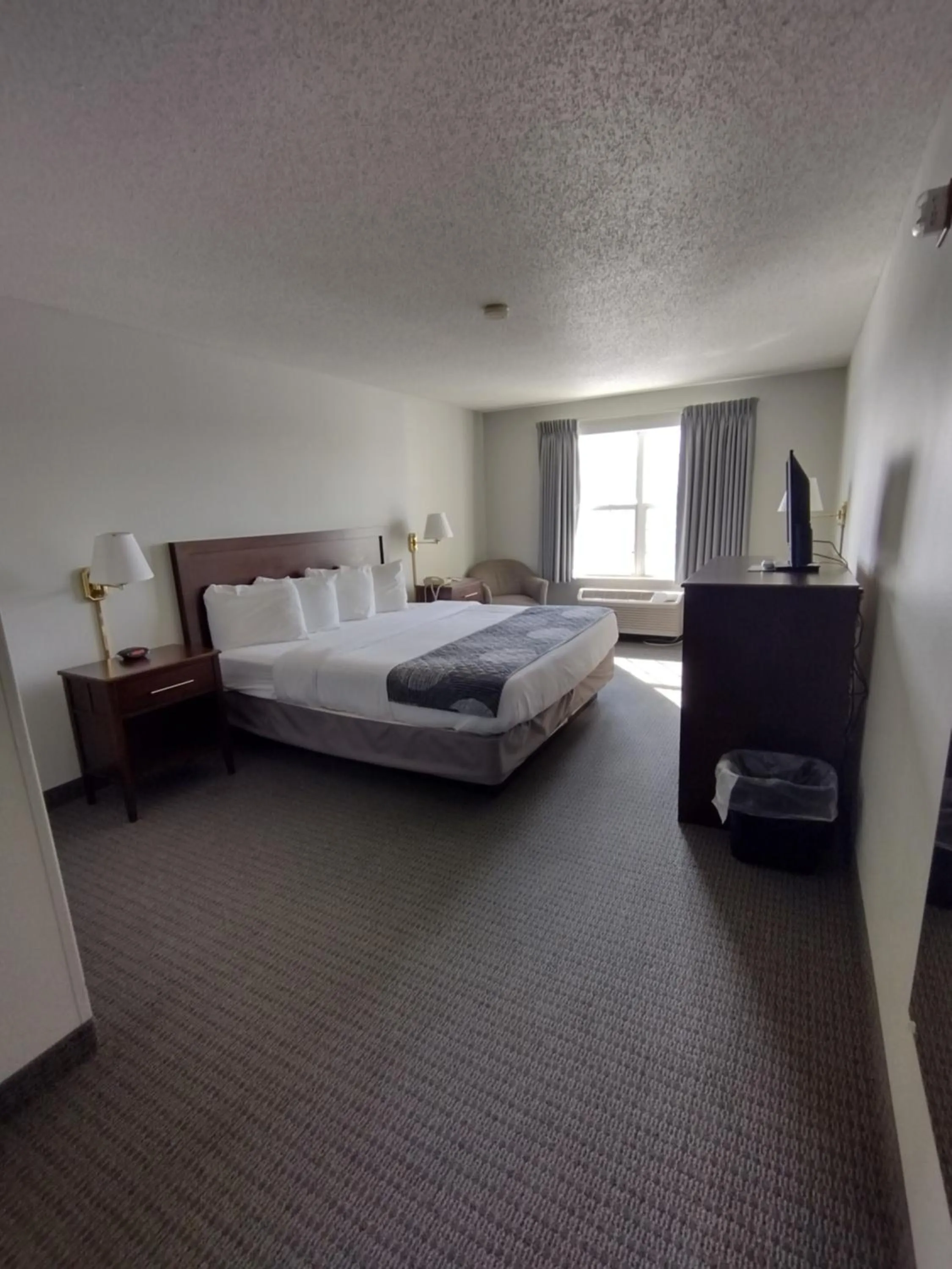 Bed in GrandStay Hotel & Suites Hastings