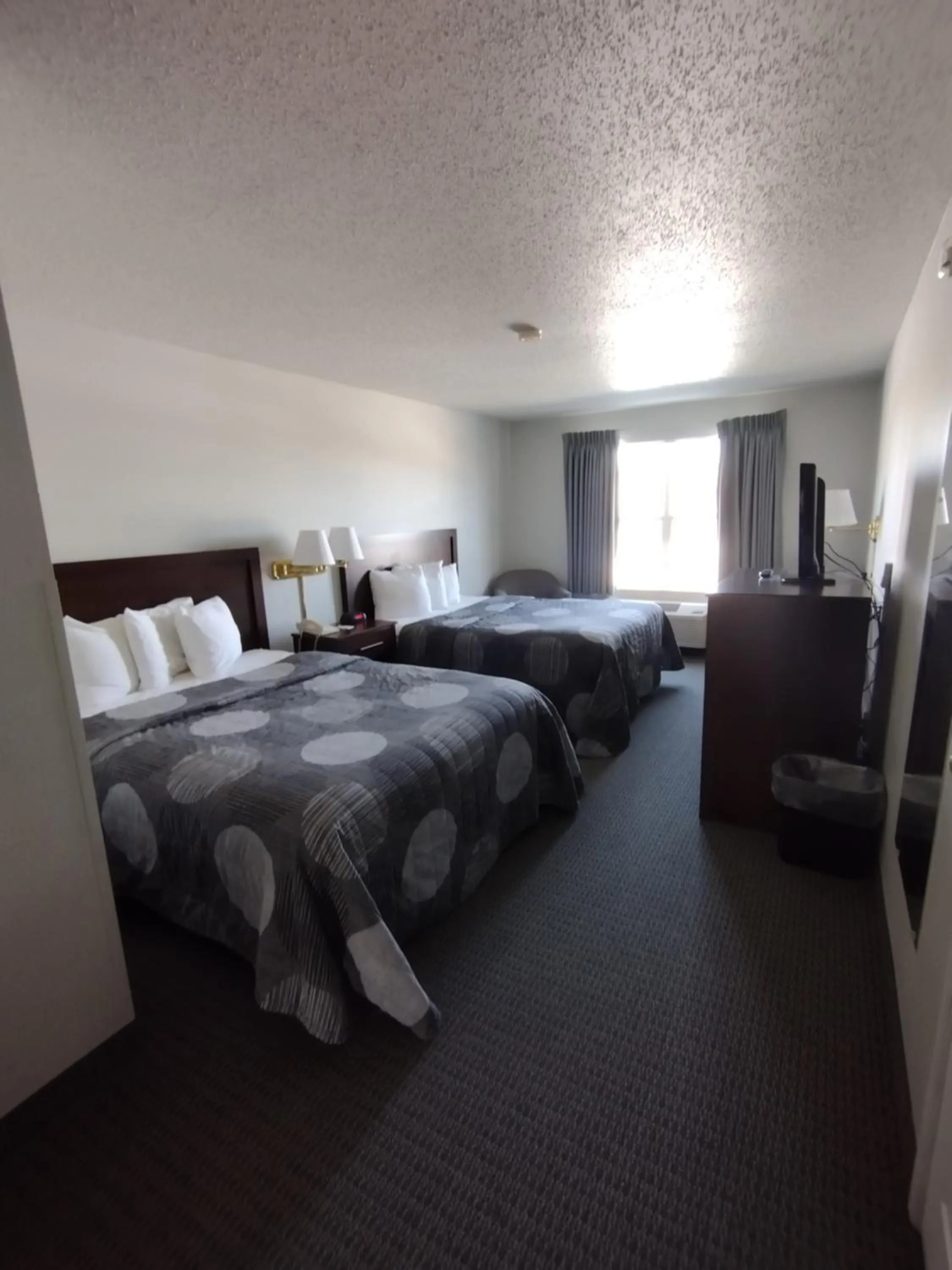 Bed in GrandStay Hotel & Suites Hastings