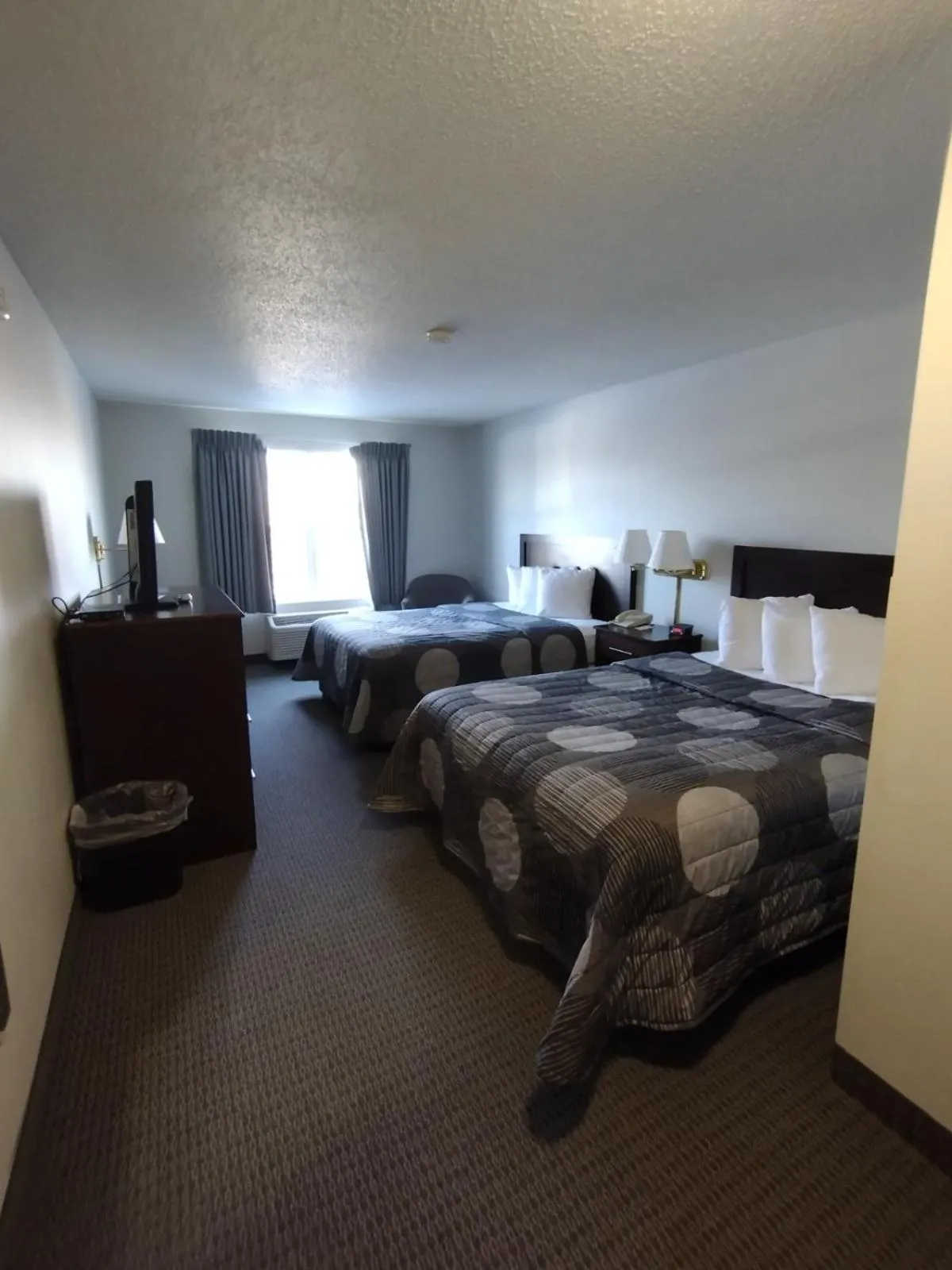 Bed in GrandStay Hotel & Suites Hastings