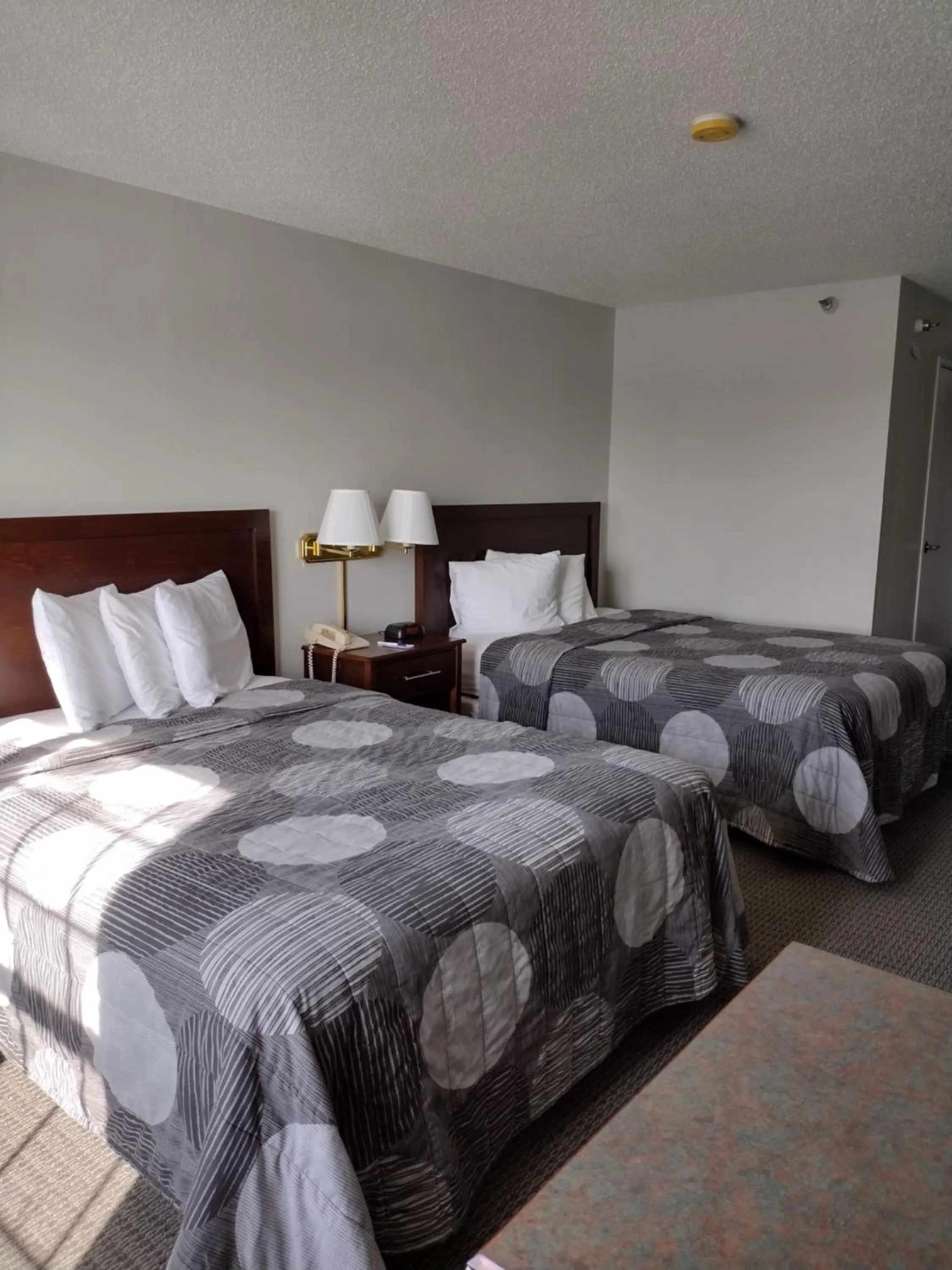 Bed in GrandStay Hotel & Suites Hastings