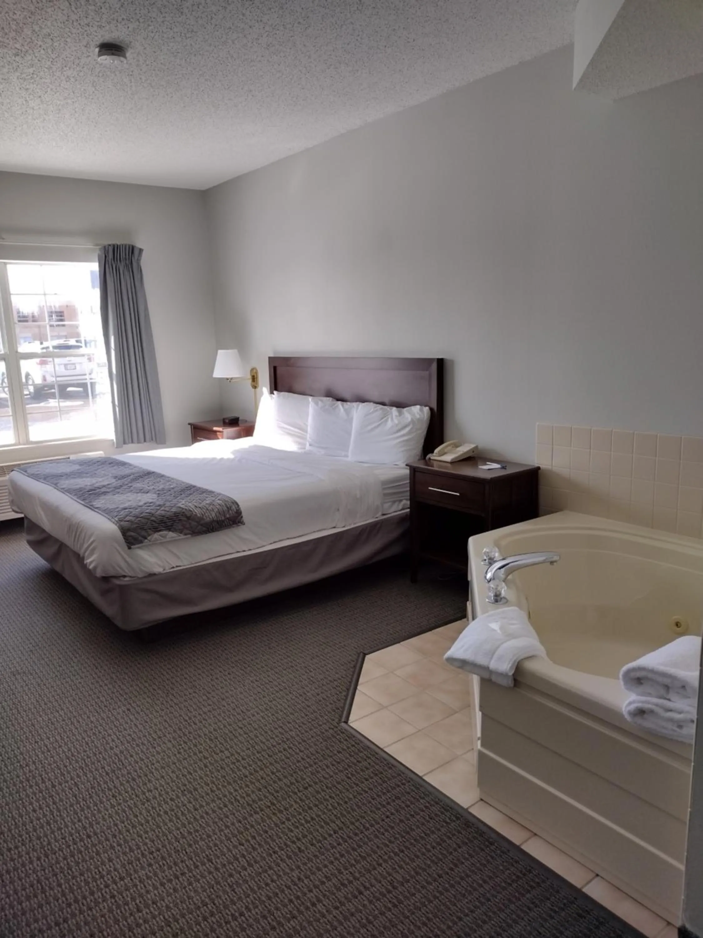 Bed in GrandStay Hotel & Suites Hastings