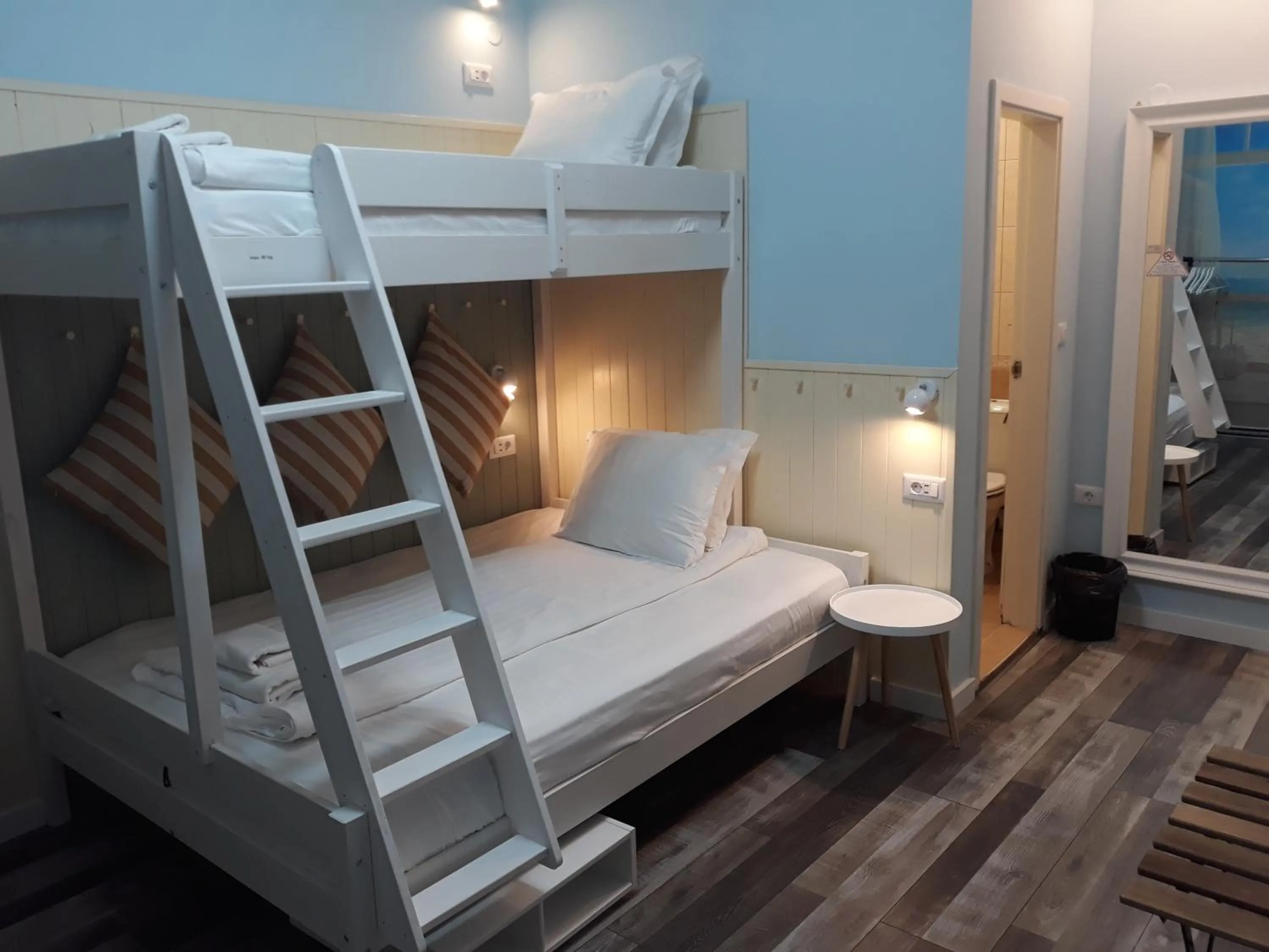 bunk bed, Bed in Three Dolphins Hotel with a Rooftop terracе