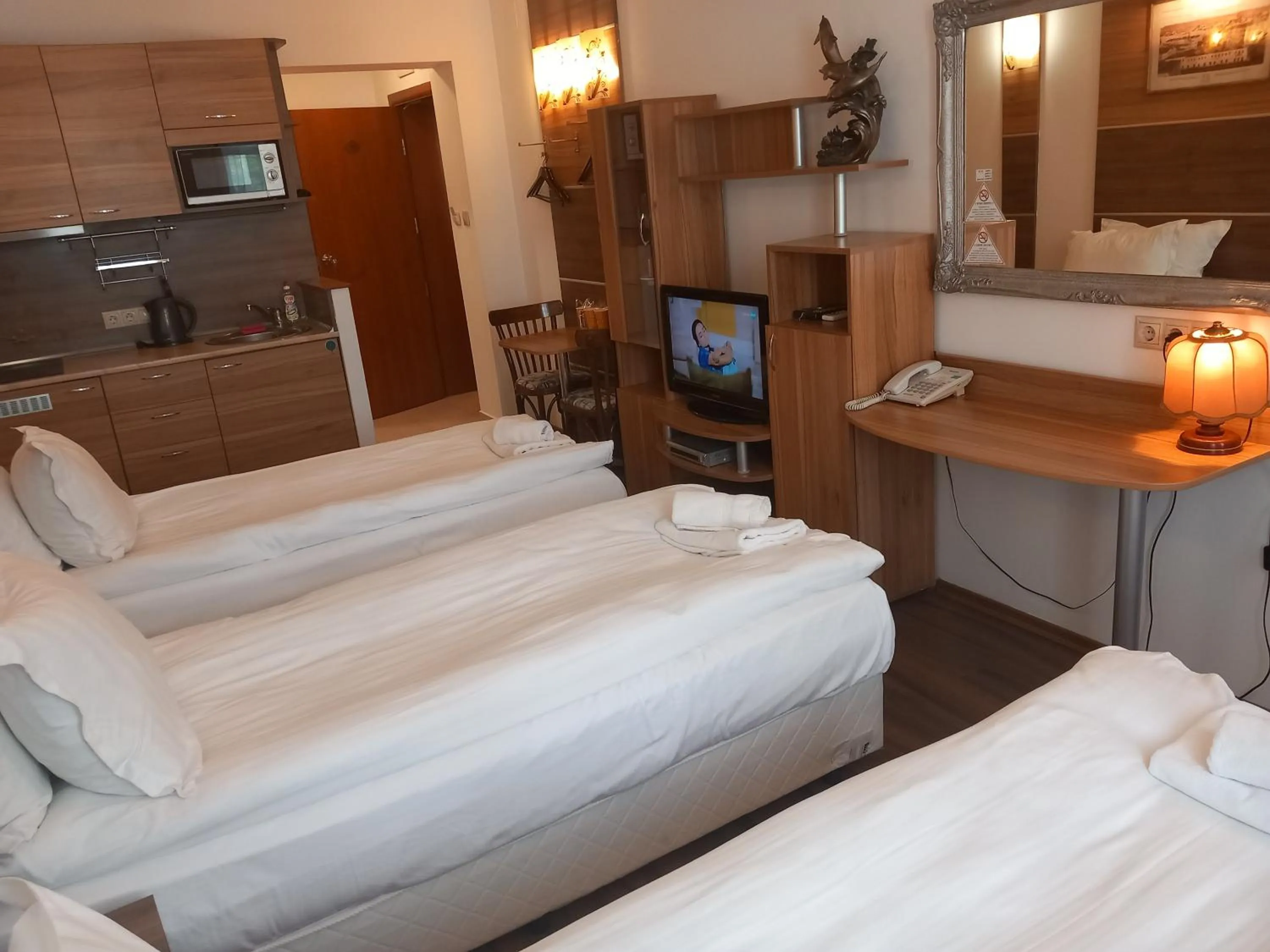 Bed in Three Dolphins Hotel with a Rooftop terracе