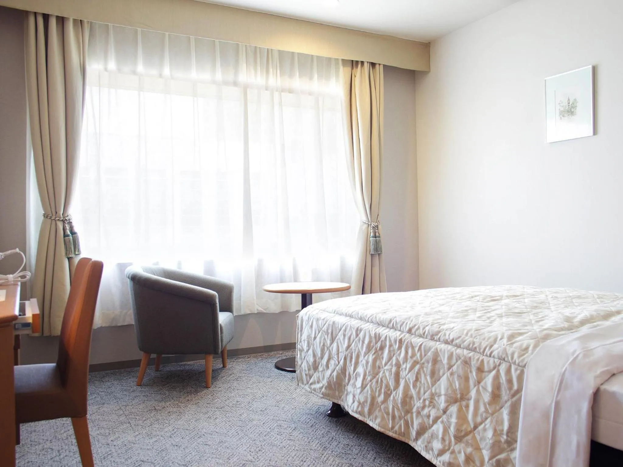 Bed in Hotel Crown Palais Hamamatsu