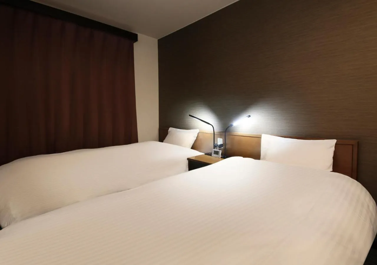 Bed in New Miyako Hotel Ashikaga Annex