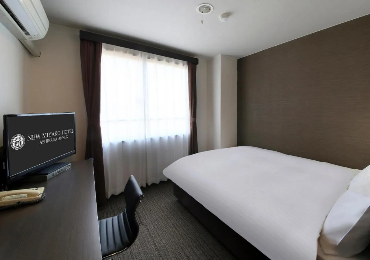 Bed in New Miyako Hotel Ashikaga Annex
