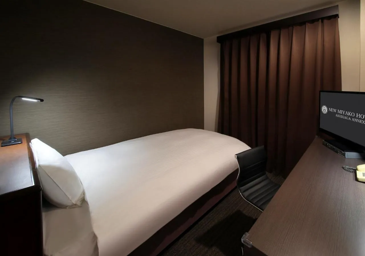 Bed in New Miyako Hotel Ashikaga Annex