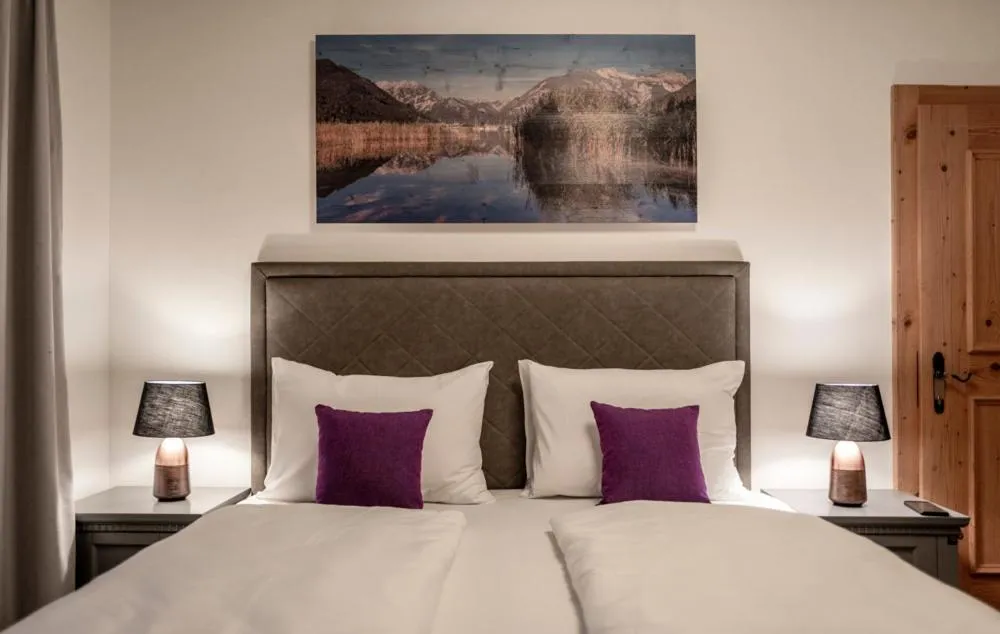 Bed in Arthur's Hotel und Apartments am Achensee