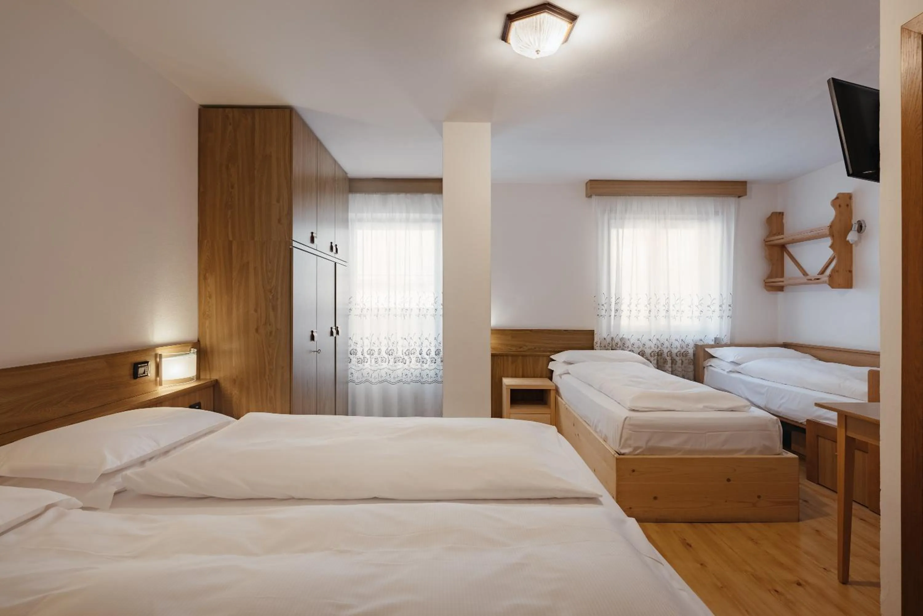 Photo of the whole room, Bed in Hotel La Montanara Predazzo