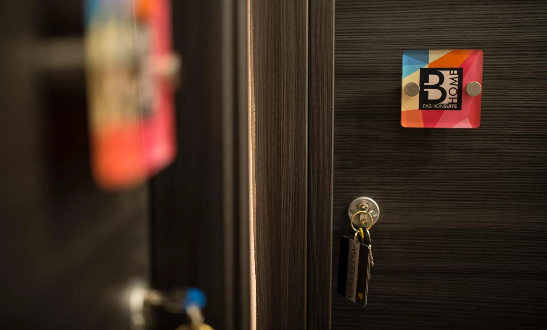 Property logo or sign in BHome Fashion Suite