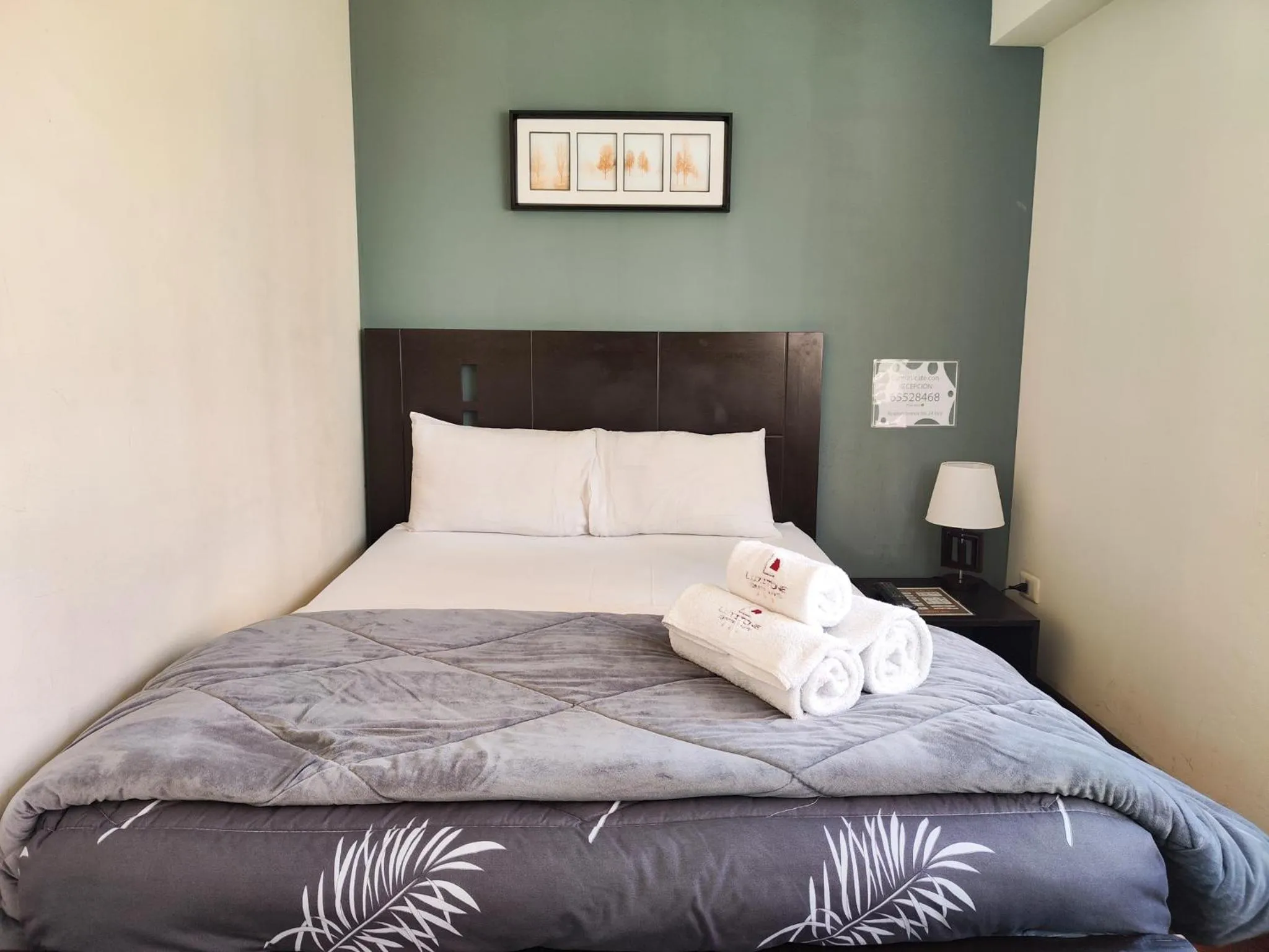 Bed in Luxstone Executive & Suites