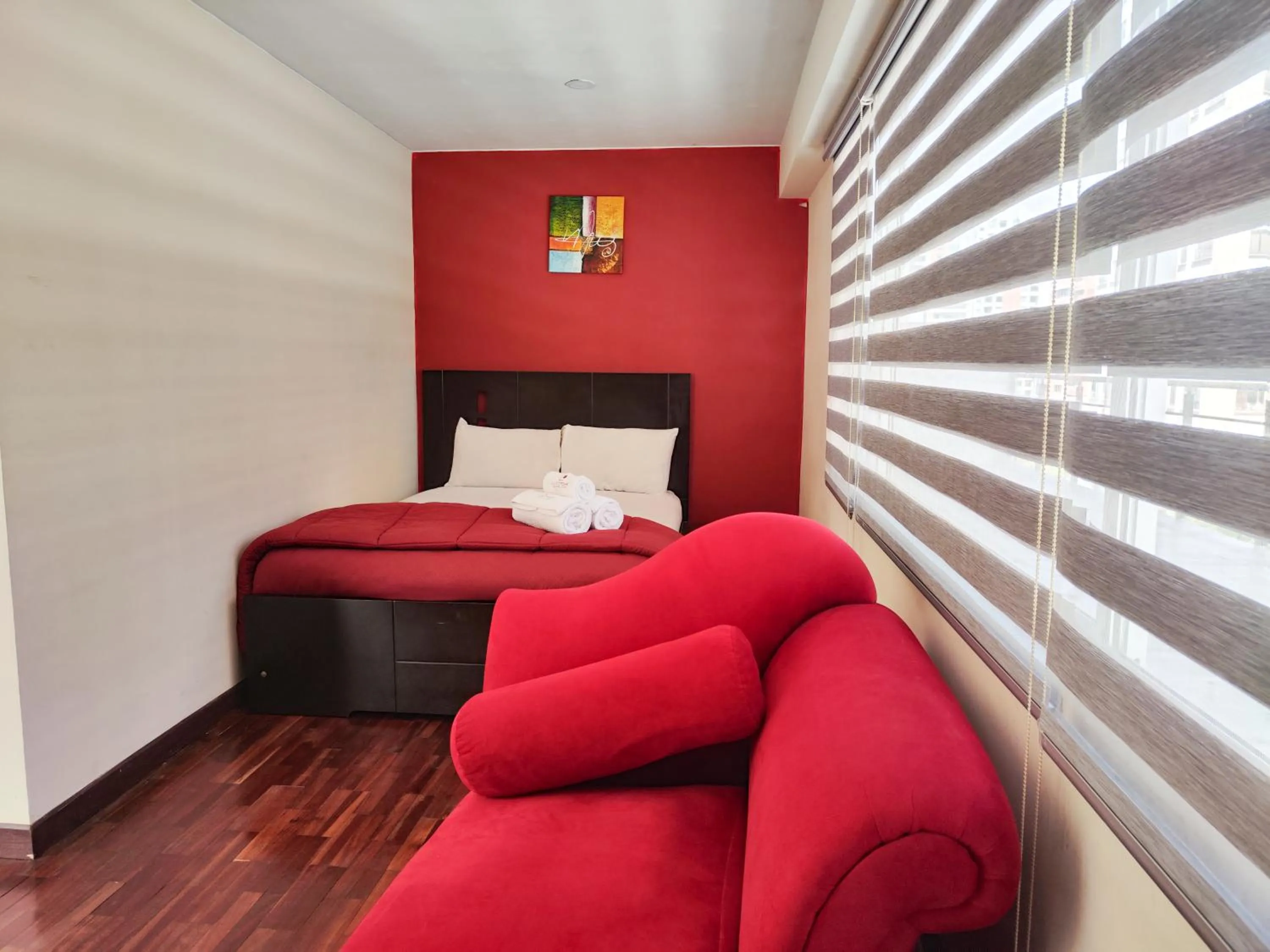 Bed in Luxstone Executive & Suites