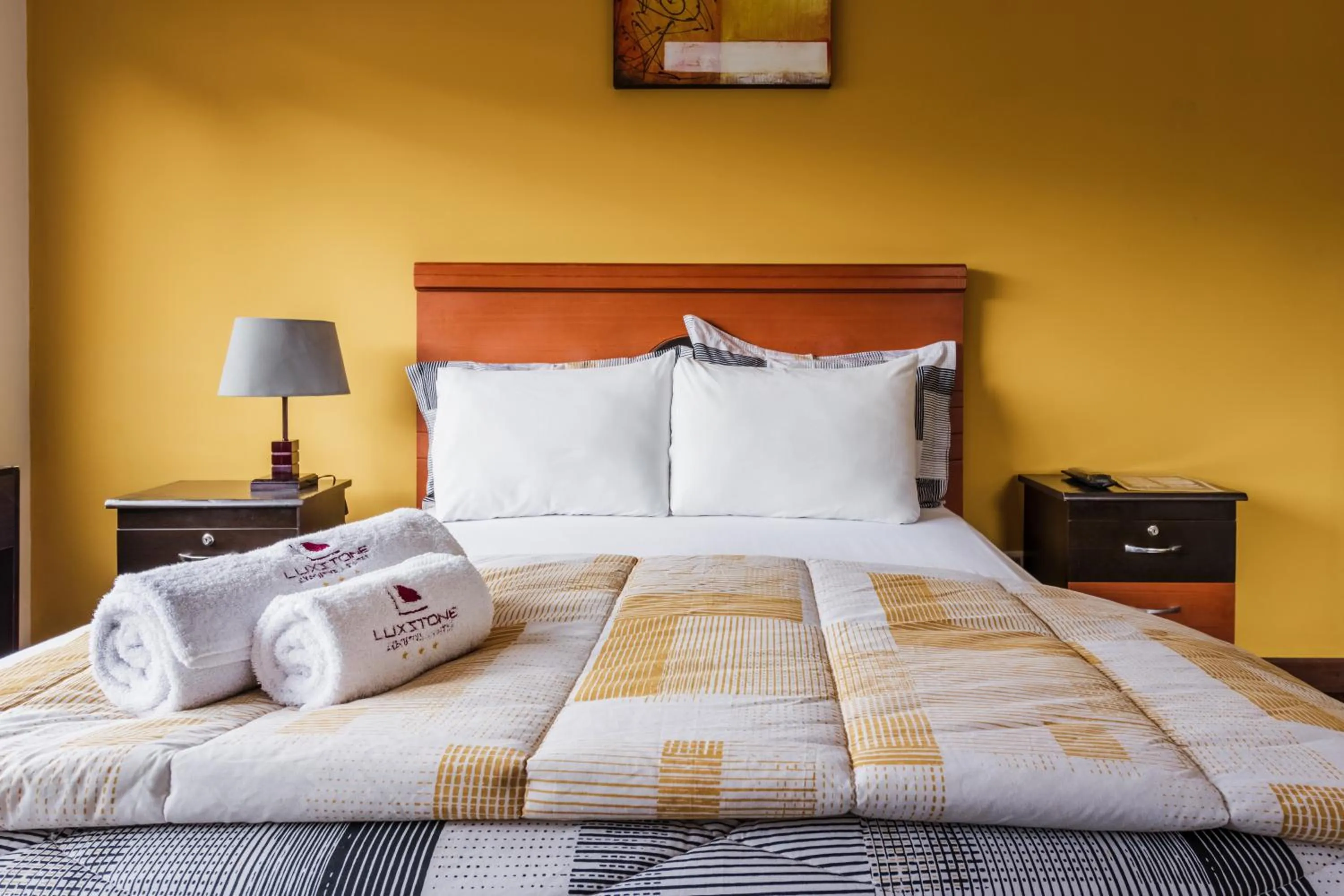 Bed in Luxstone Executive & Suites