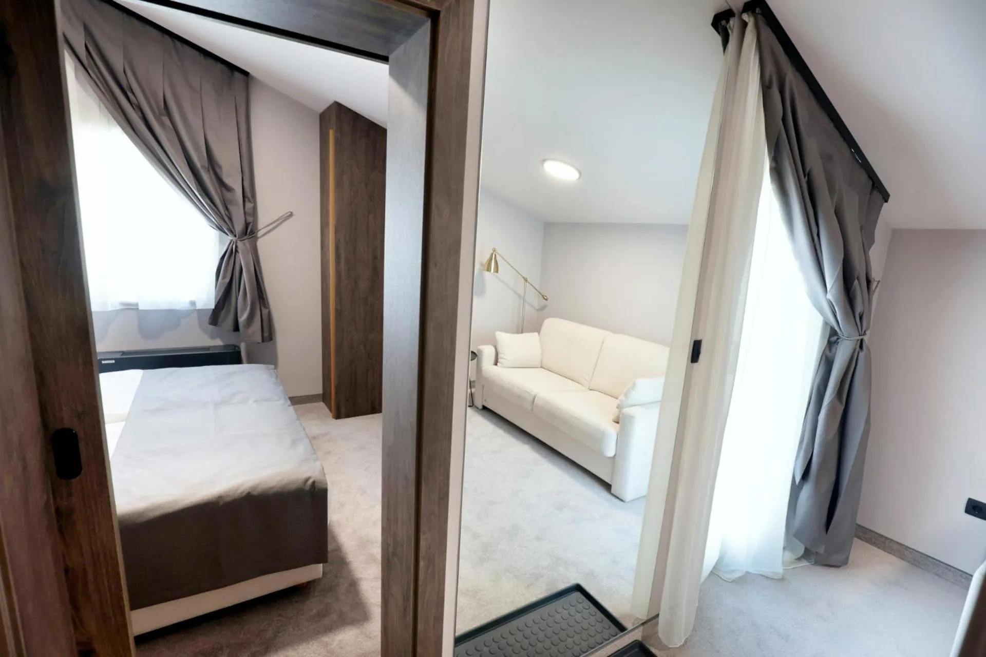 Living room, Bed in Hotel Milenij