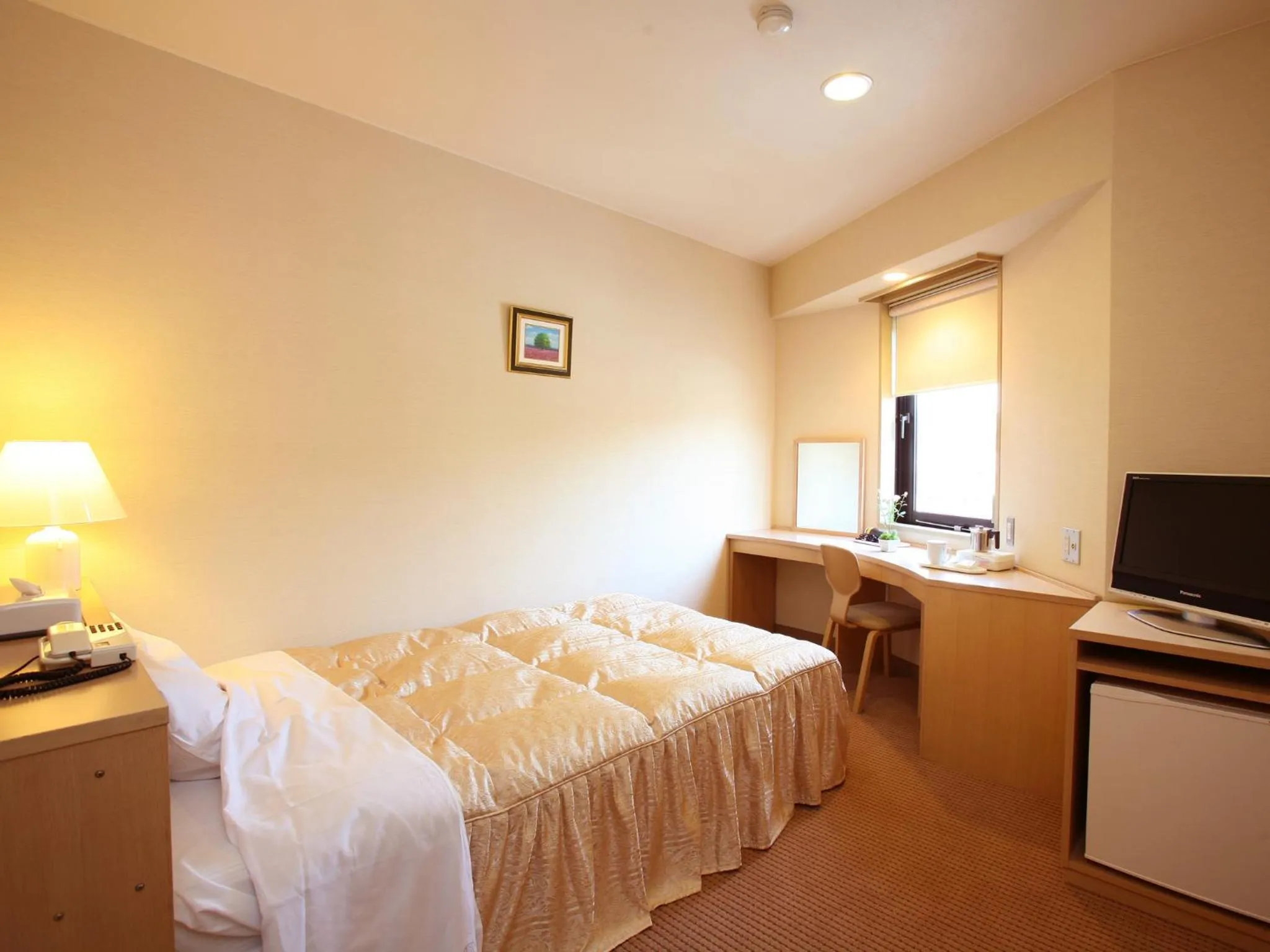 Bed in Hotel Pearl City Tendo