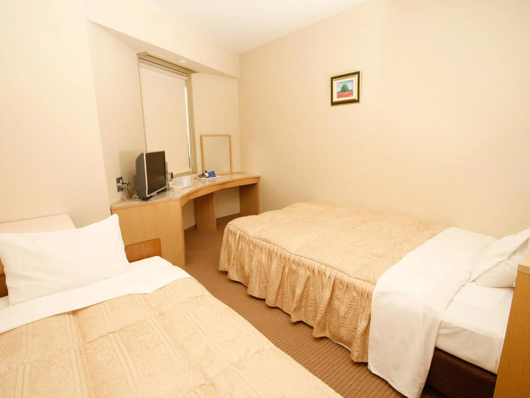 Bed in Hotel Pearl City Tendo