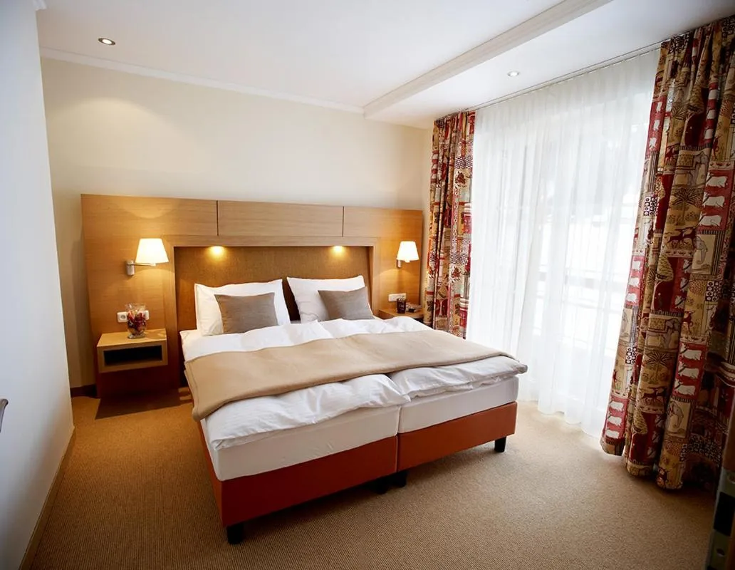 Bed in Sonnblick Apartments und Zimmer - Nationalpark Sommercard inklusive