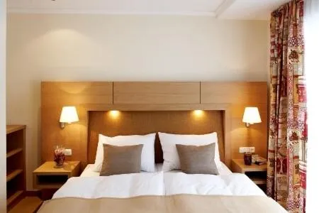 Bed in Sonnblick Apartments und Zimmer - Nationalpark Sommercard inklusive