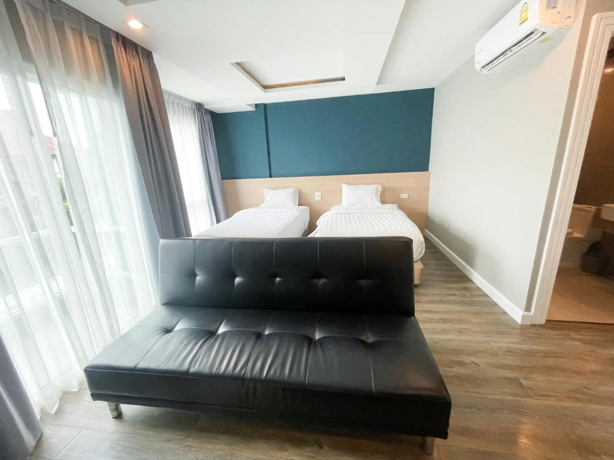 Bed in Wisdom Hotel & Residence