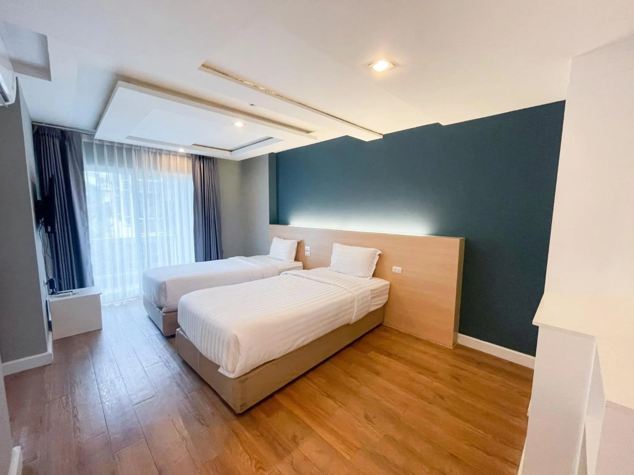 Bed in Wisdom Hotel & Residence