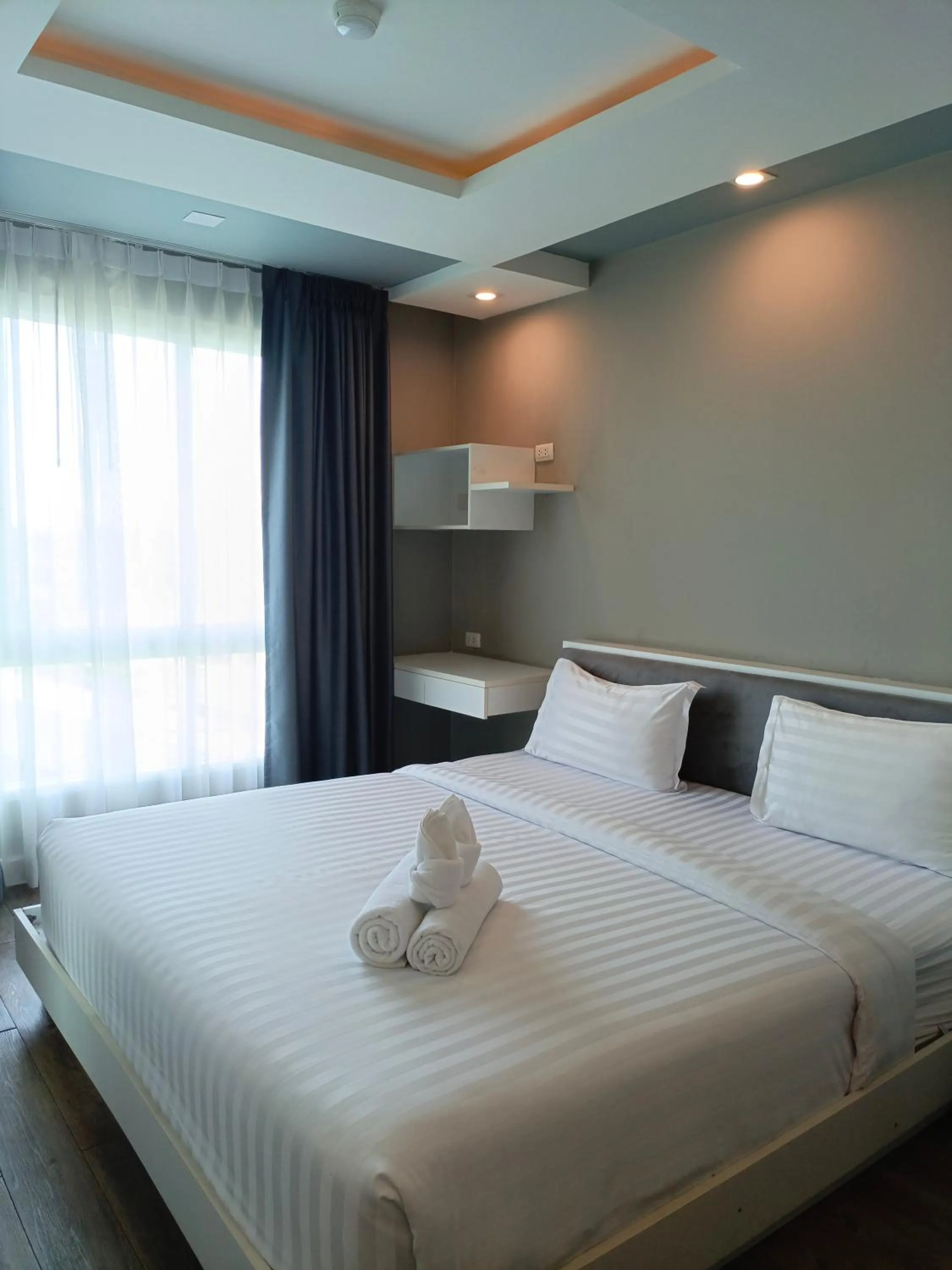 Bed in Wisdom Hotel & Residence