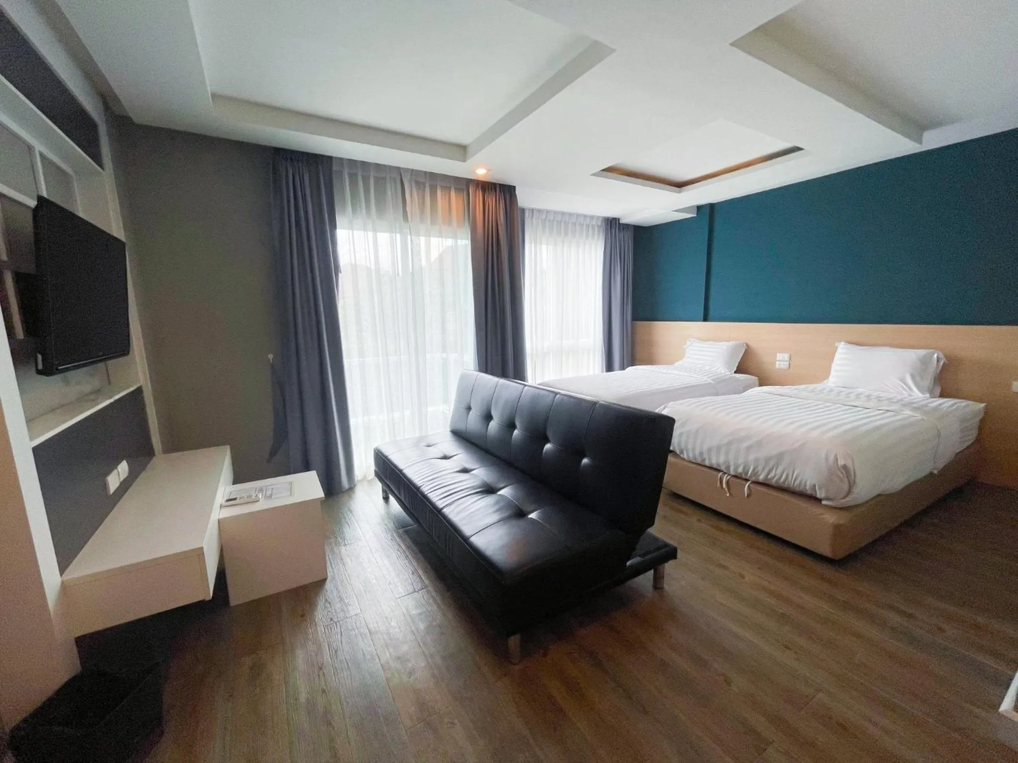 Bed in Wisdom Hotel & Residence
