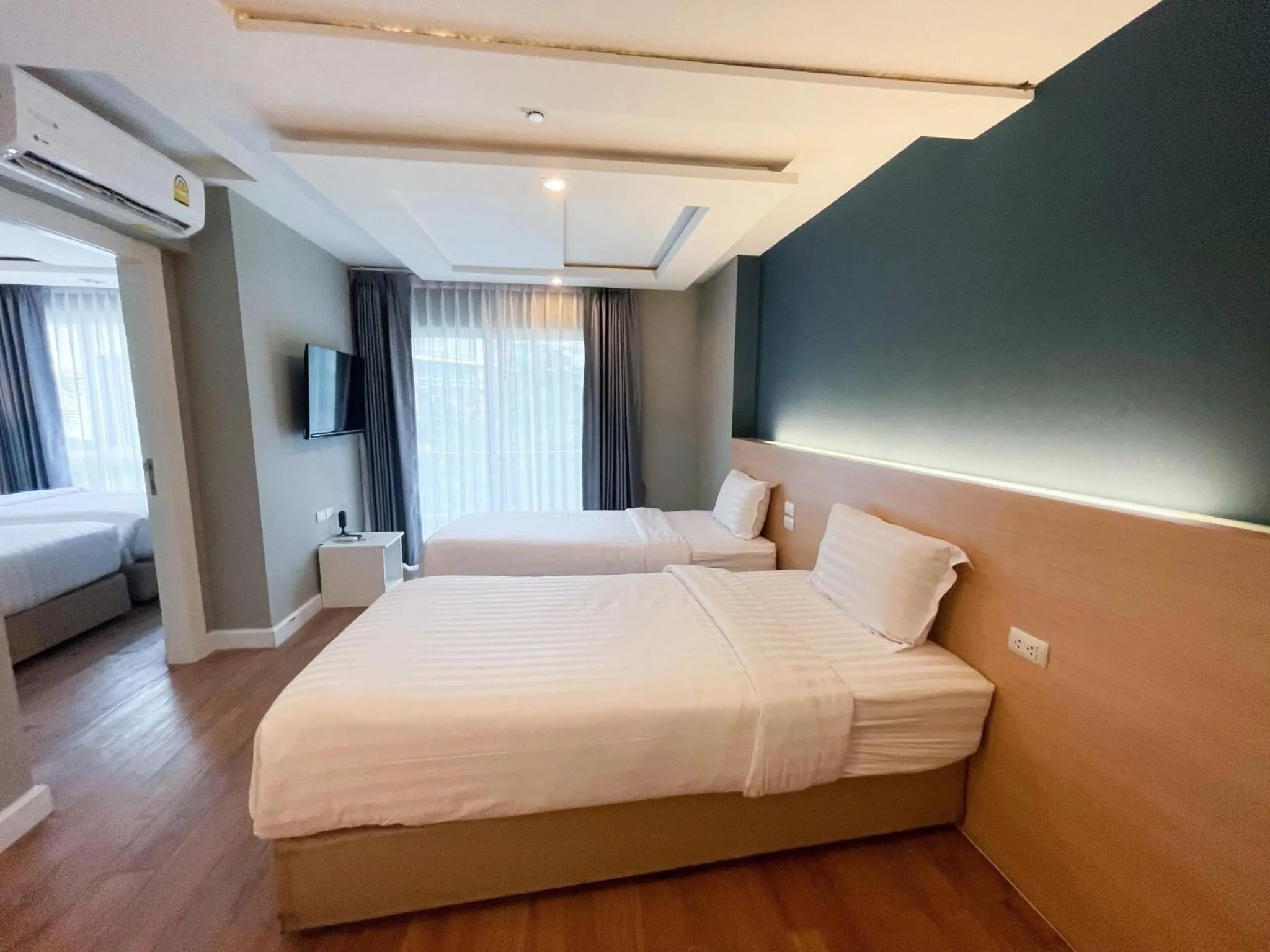 Bed in Wisdom Hotel & Residence