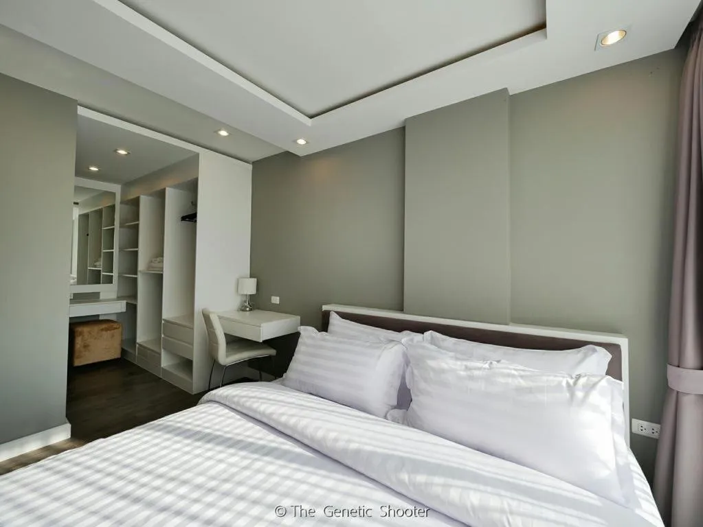 Bed in Wisdom Hotel & Residence