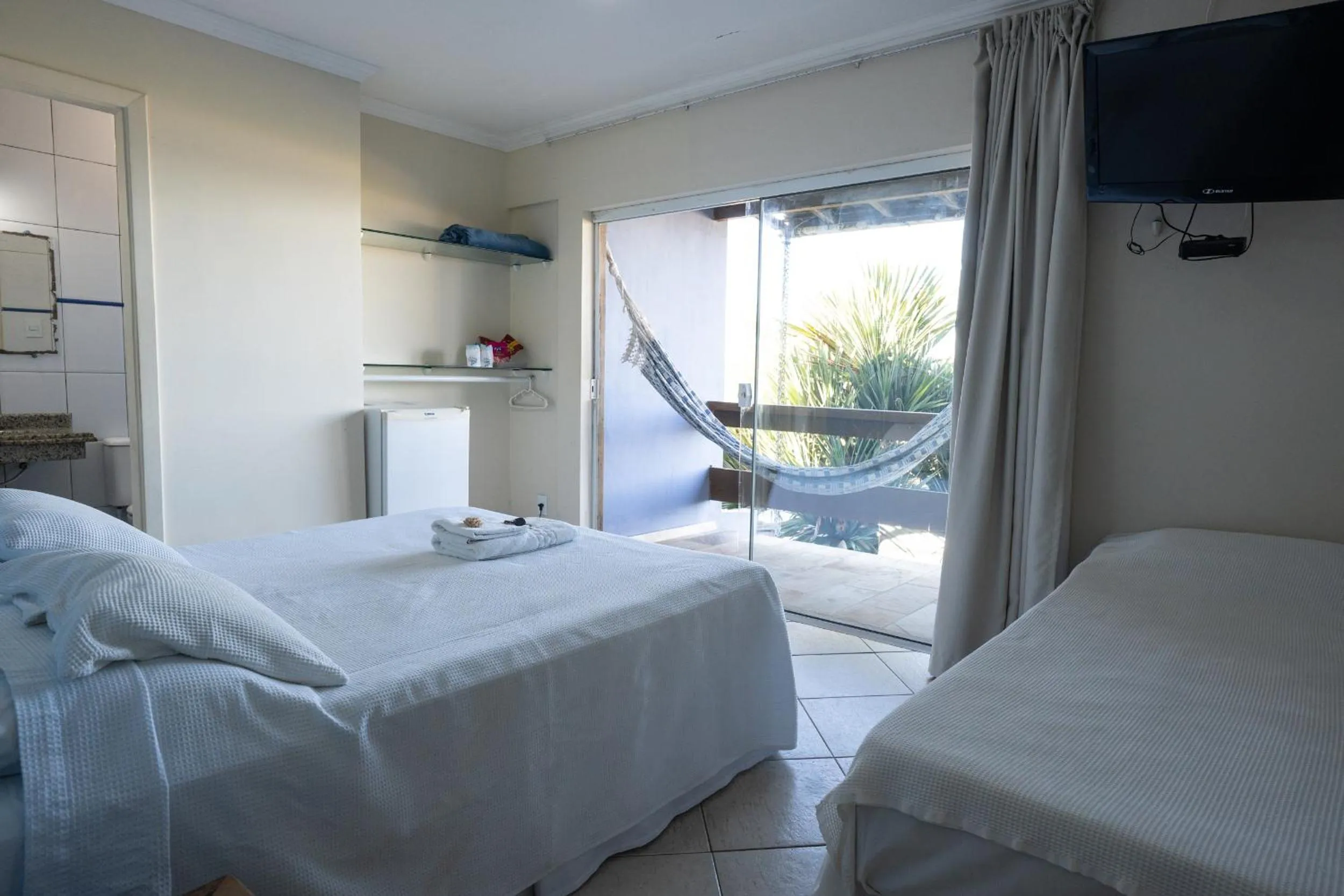 Bed in Pousada On Shore