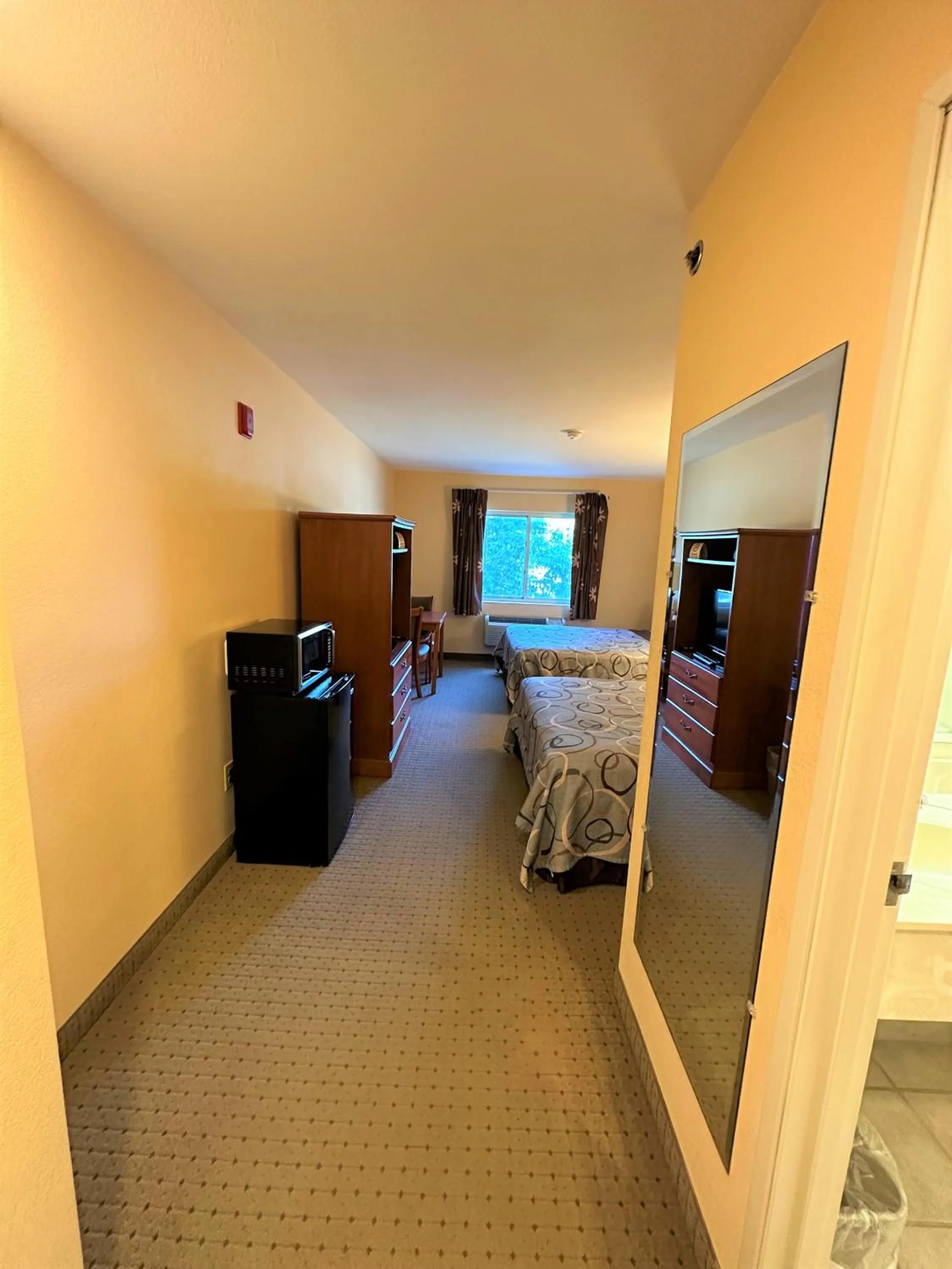 Photo of the whole room, Bed in Super 8 by Wyndham Topeka at Forbes Landing