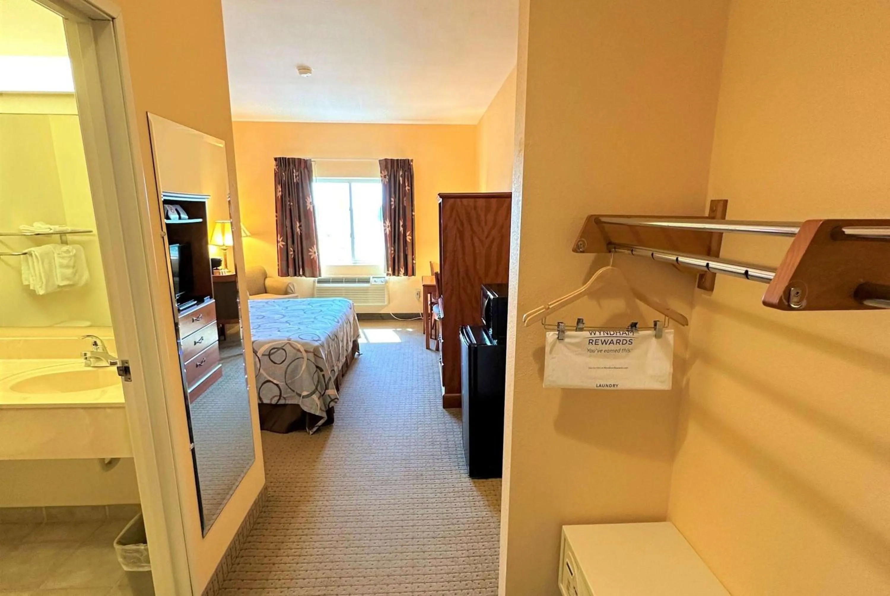 Photo of the whole room, Bed in Super 8 by Wyndham Topeka at Forbes Landing