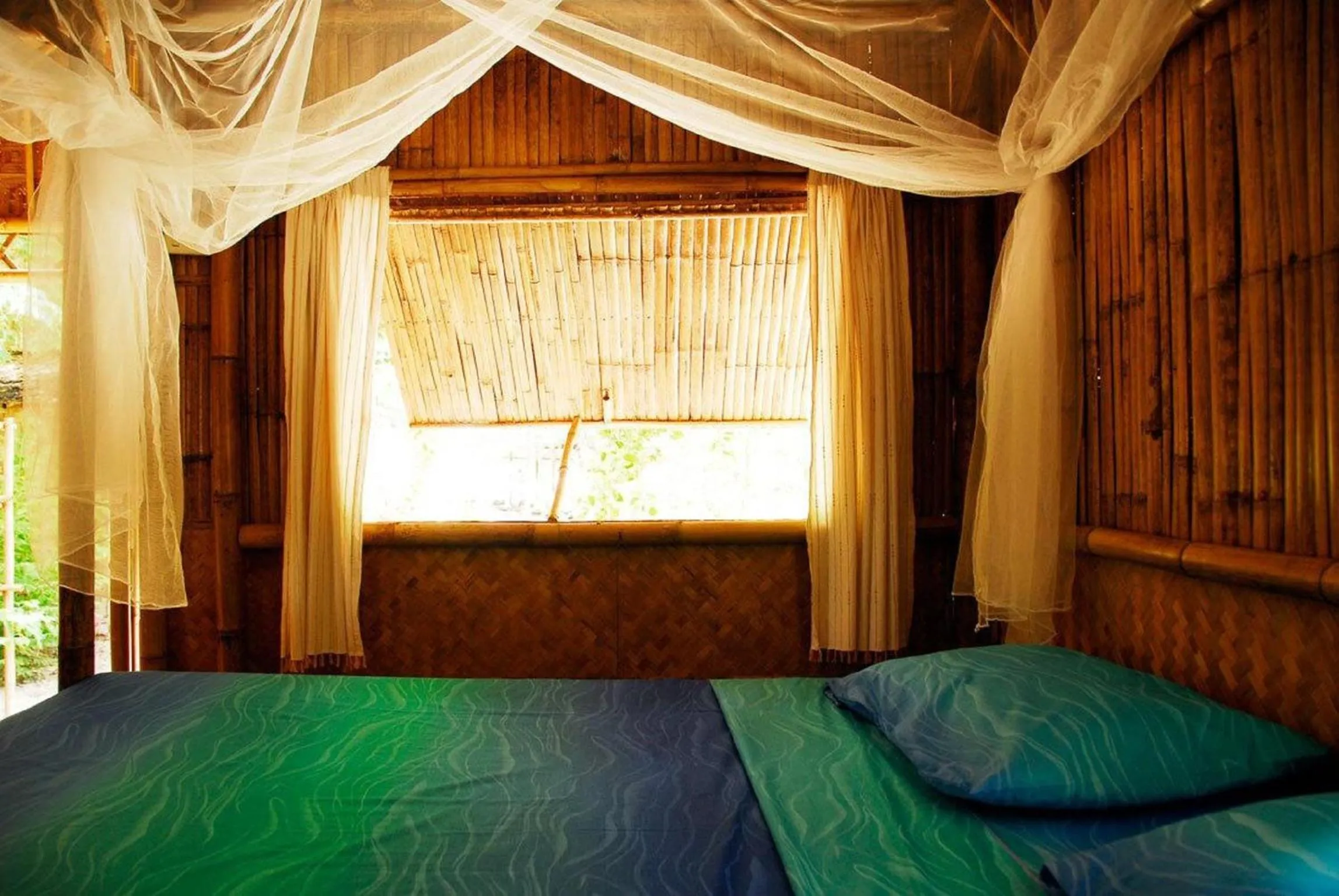 Bed in Green View Beach Resort
