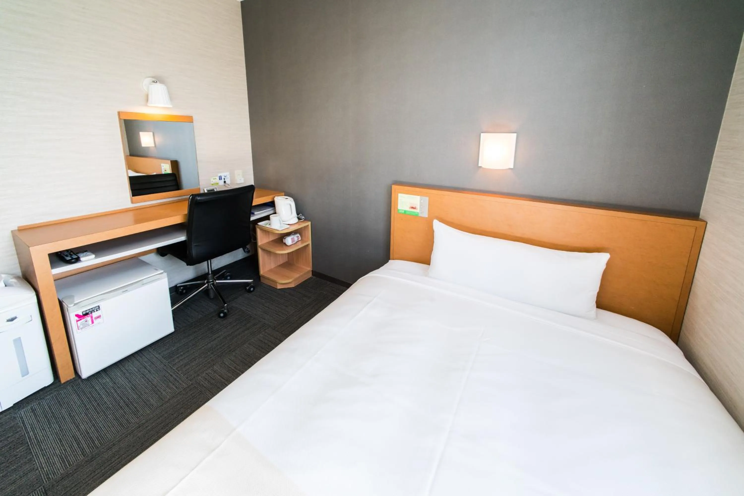 Bed in Super Hotel Minami Hikone Ekimae