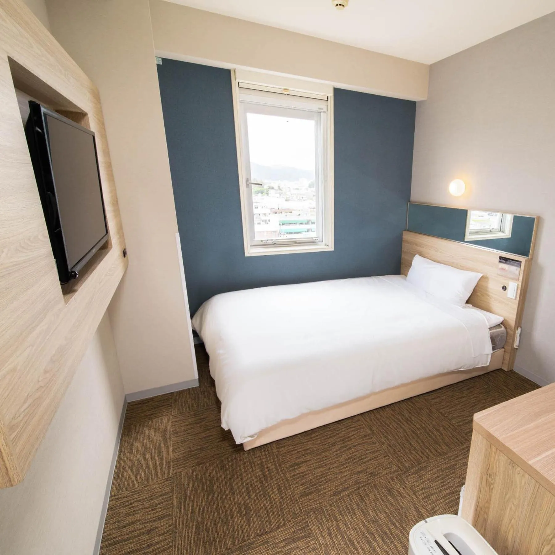 Bed in Super Hotel Okinawa Nago