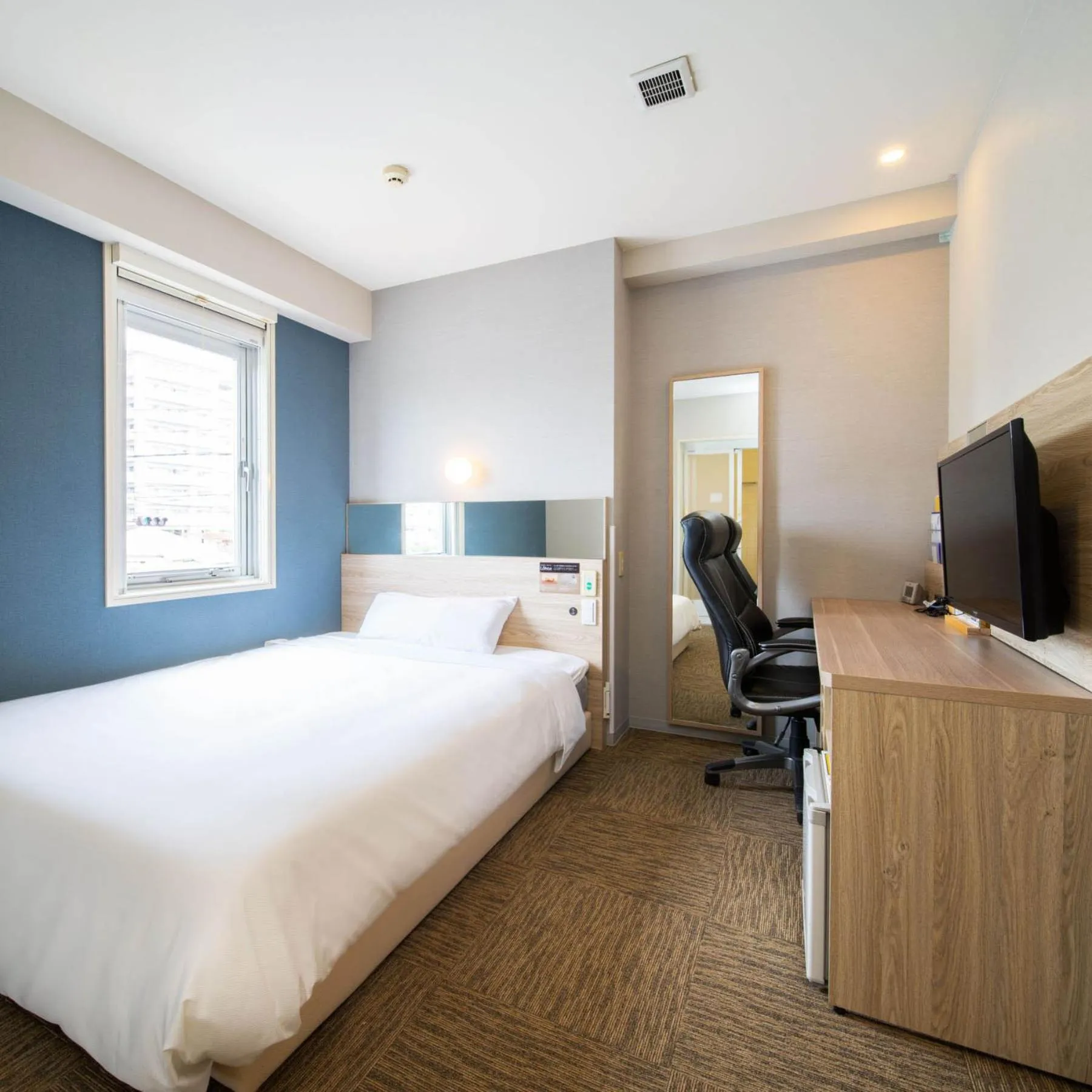 Bed in Super Hotel Okinawa Nago