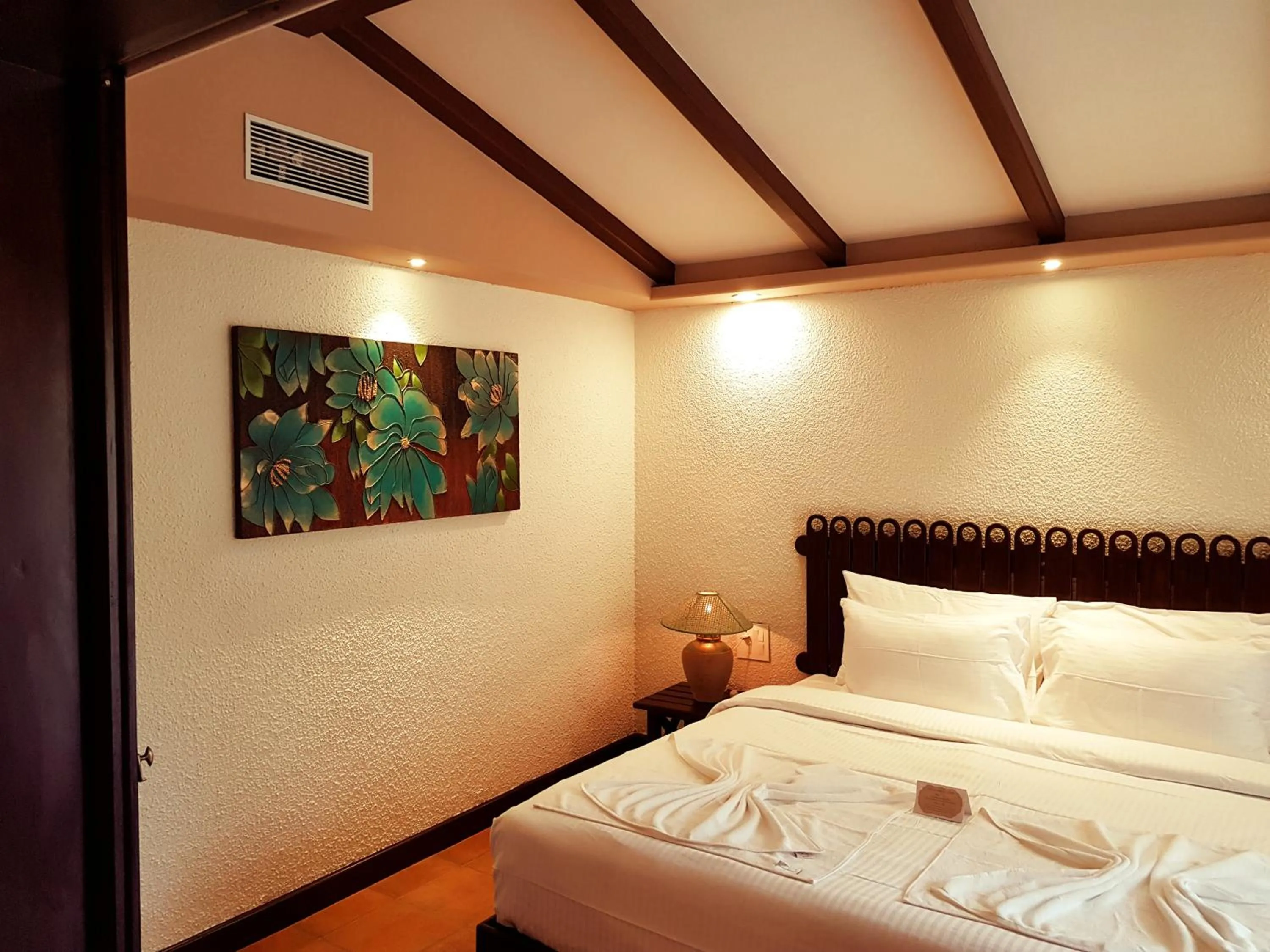 Bed in Ziva Suites - A Botique Hotel