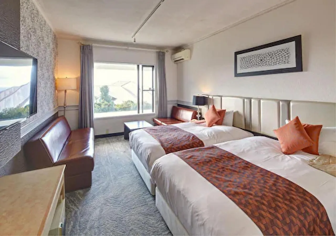 Photo of the whole room, Bed in Royal View Hotel Churaumi