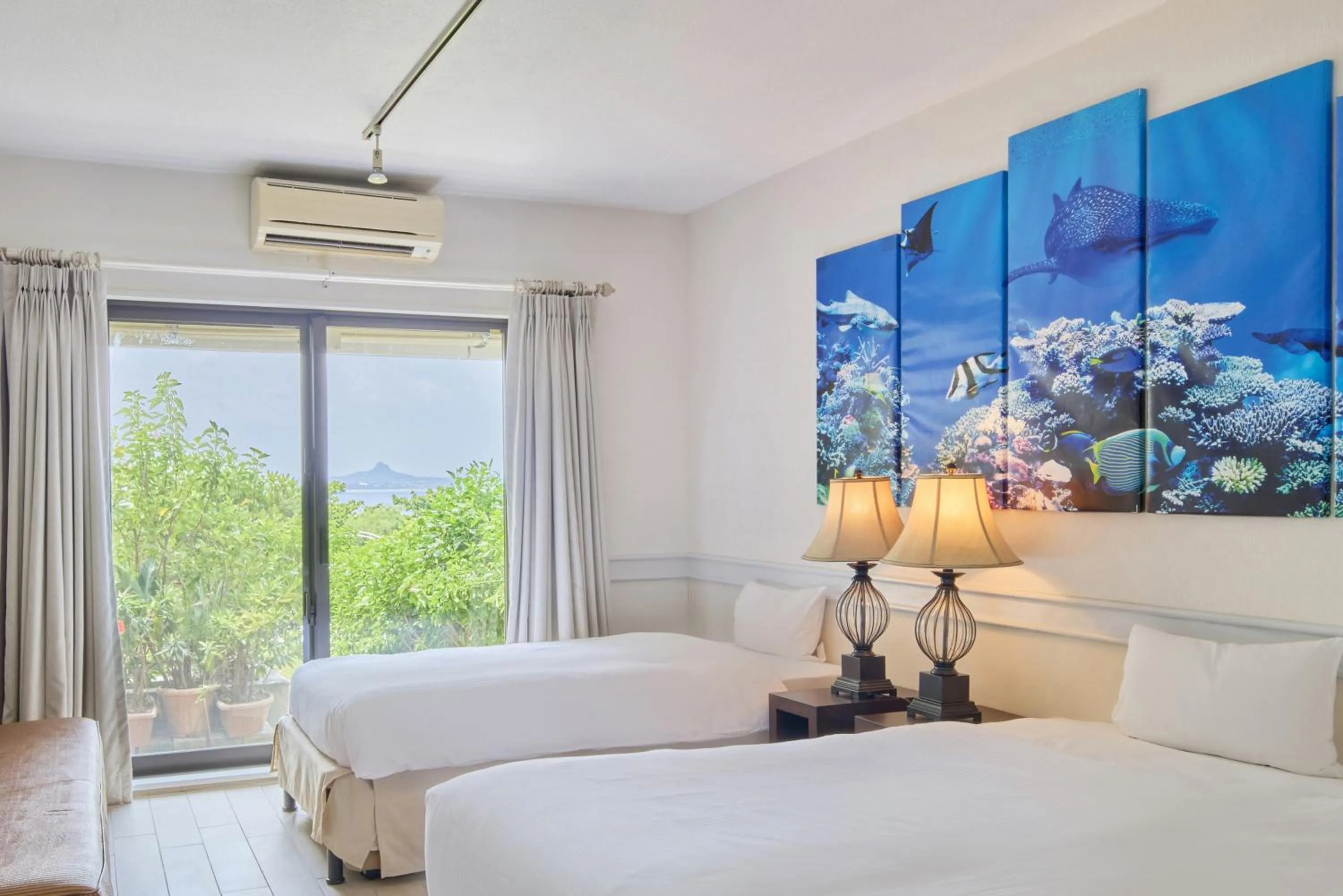 Bed in Royal View Hotel Churaumi