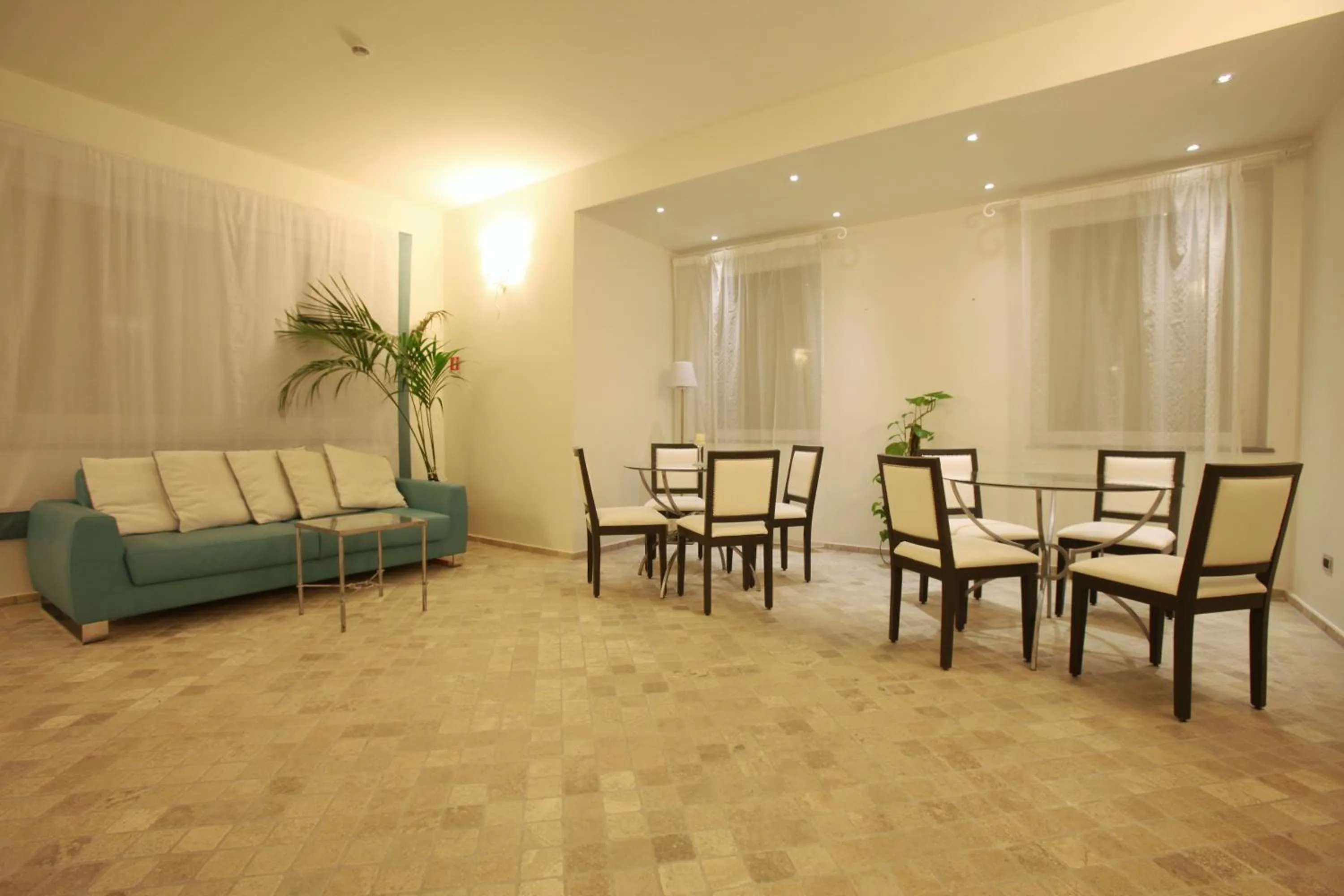 Communal lounge/ TV room in Hotel Mea - Aeolian Charme