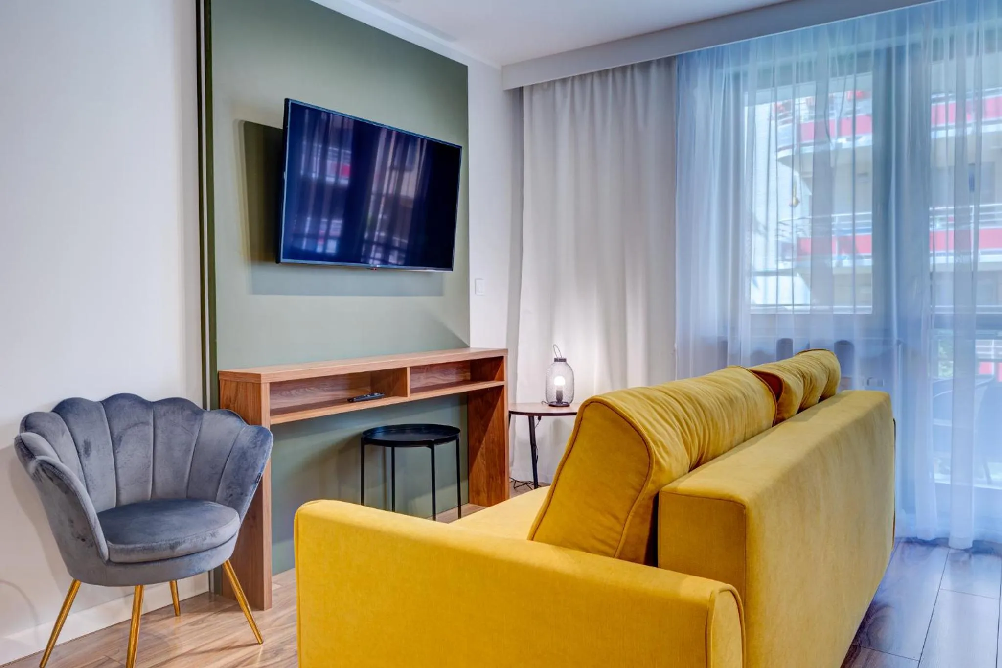 Communal lounge/ TV room in Apartamenty Zdrojowa