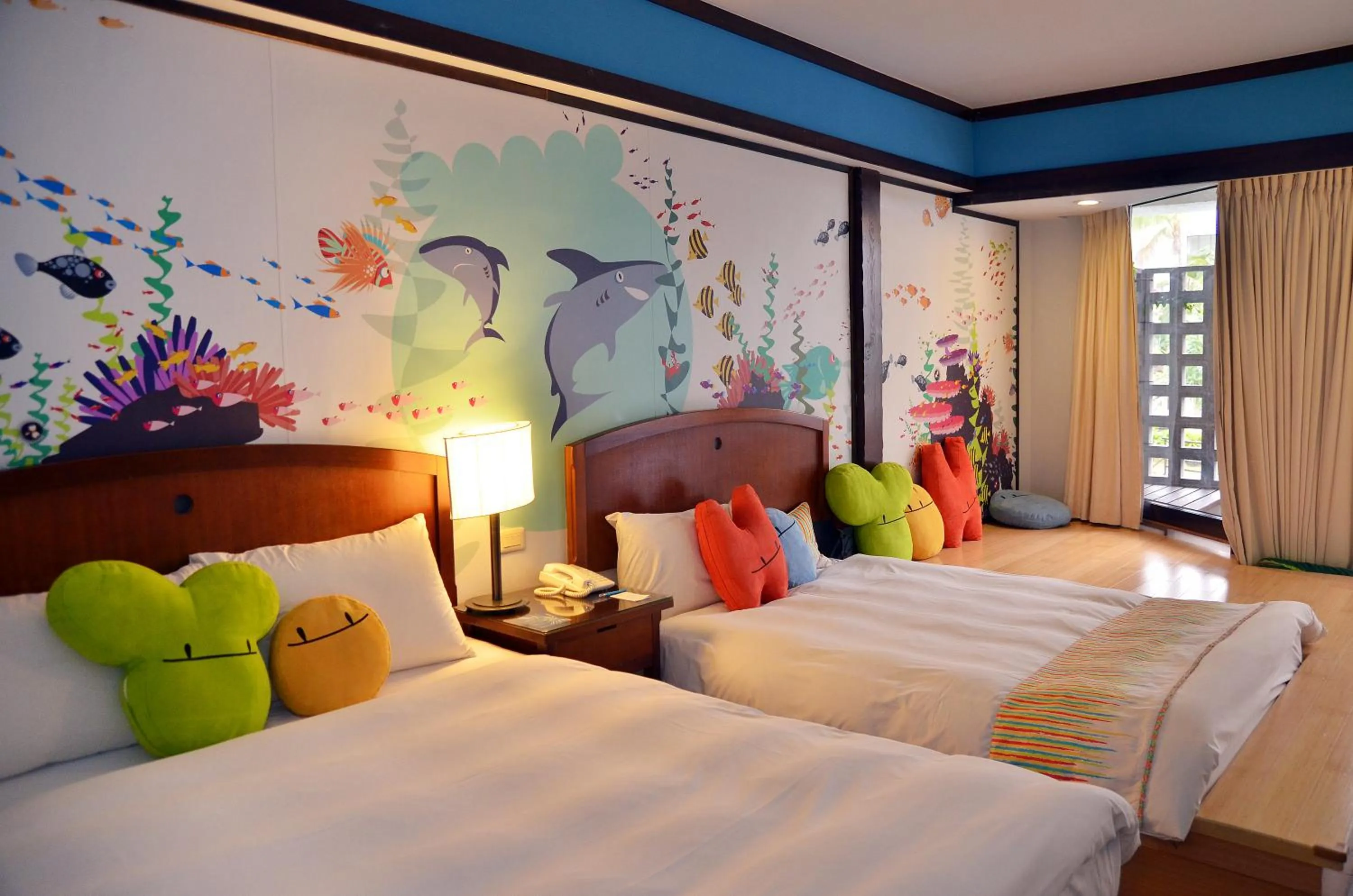 Photo of the whole room, Bed in Yoho Beach Resort Kenting