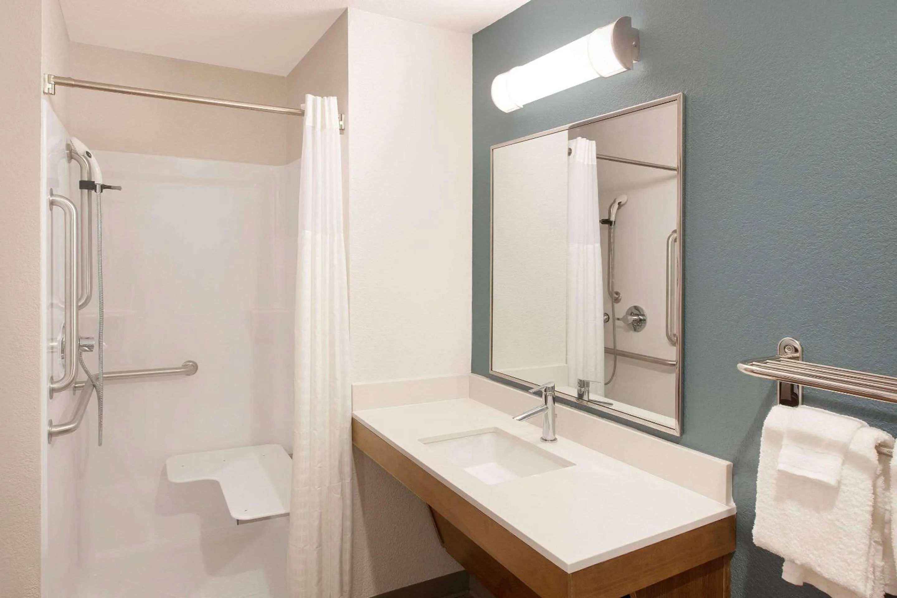 Bathroom in WoodSpring Suites Houston 288 South Medical Center