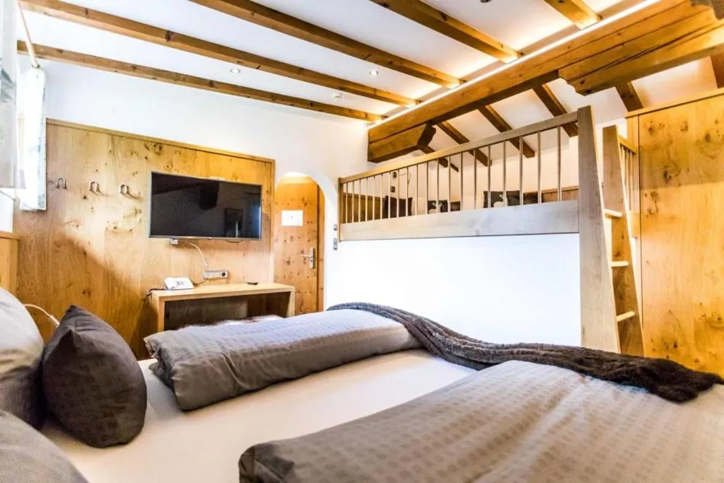 Bed in ALPENHOTEL TYROL - B&B - ADULTS ONLY - Alpines Lifestylehotel - BIO & Nachhaltig