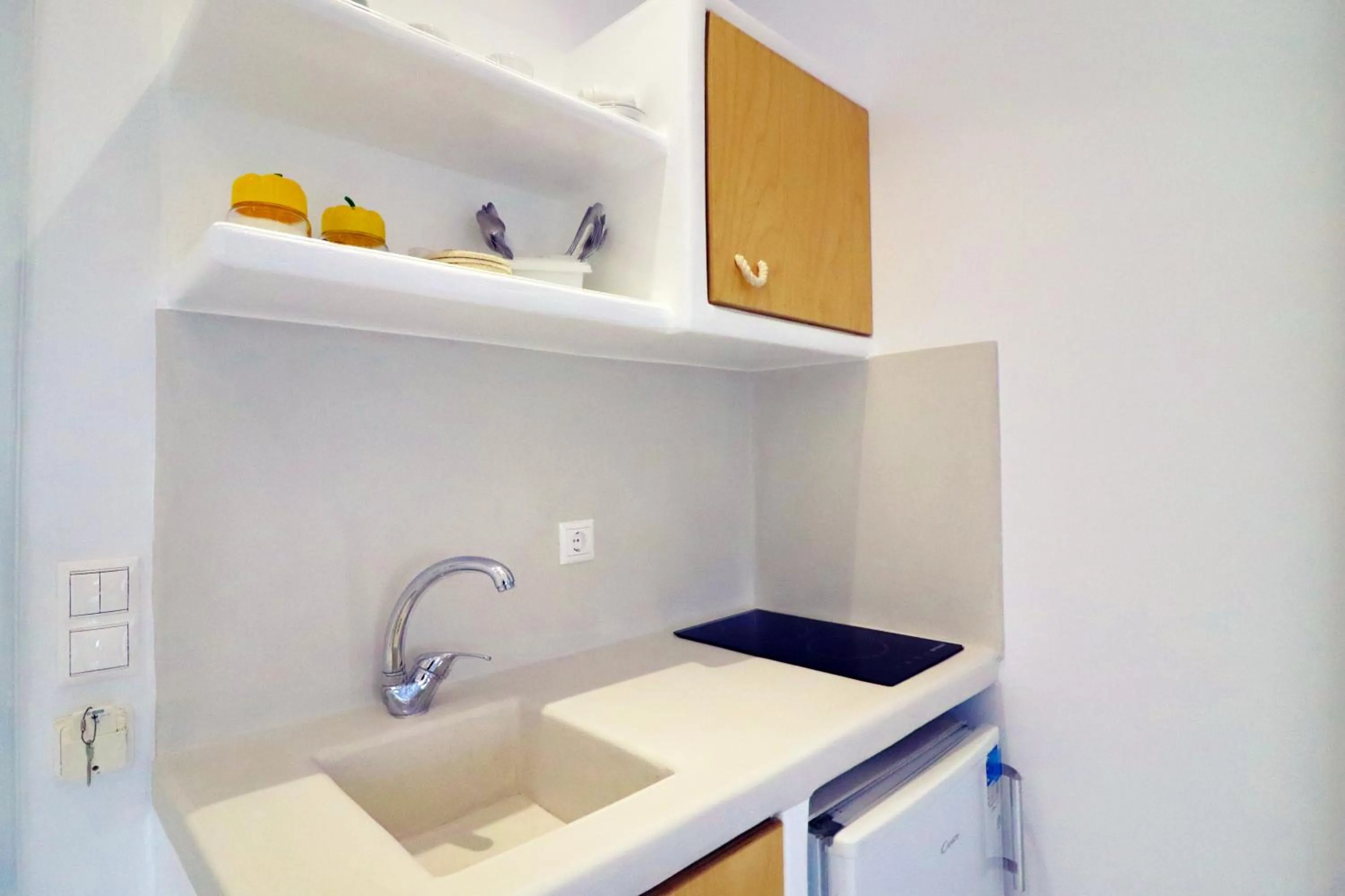 Kitchen or kitchenette in Coralli Beach Apartments