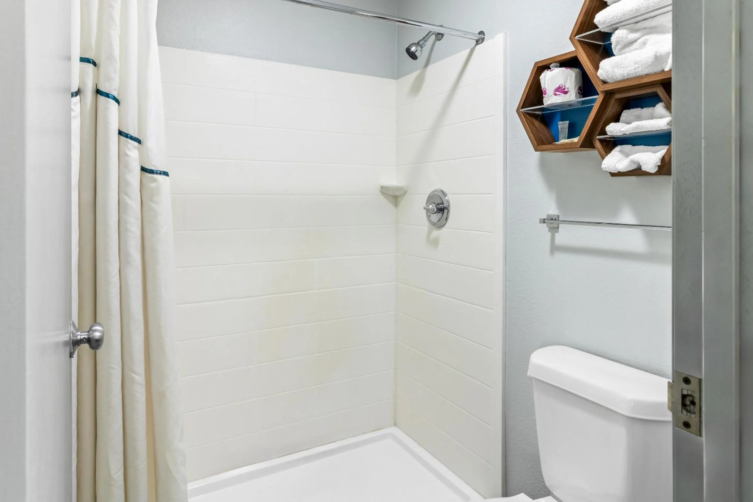 Shower in HomeTowne Studios by Red Roof Florence, KY-Cincinnati Airport