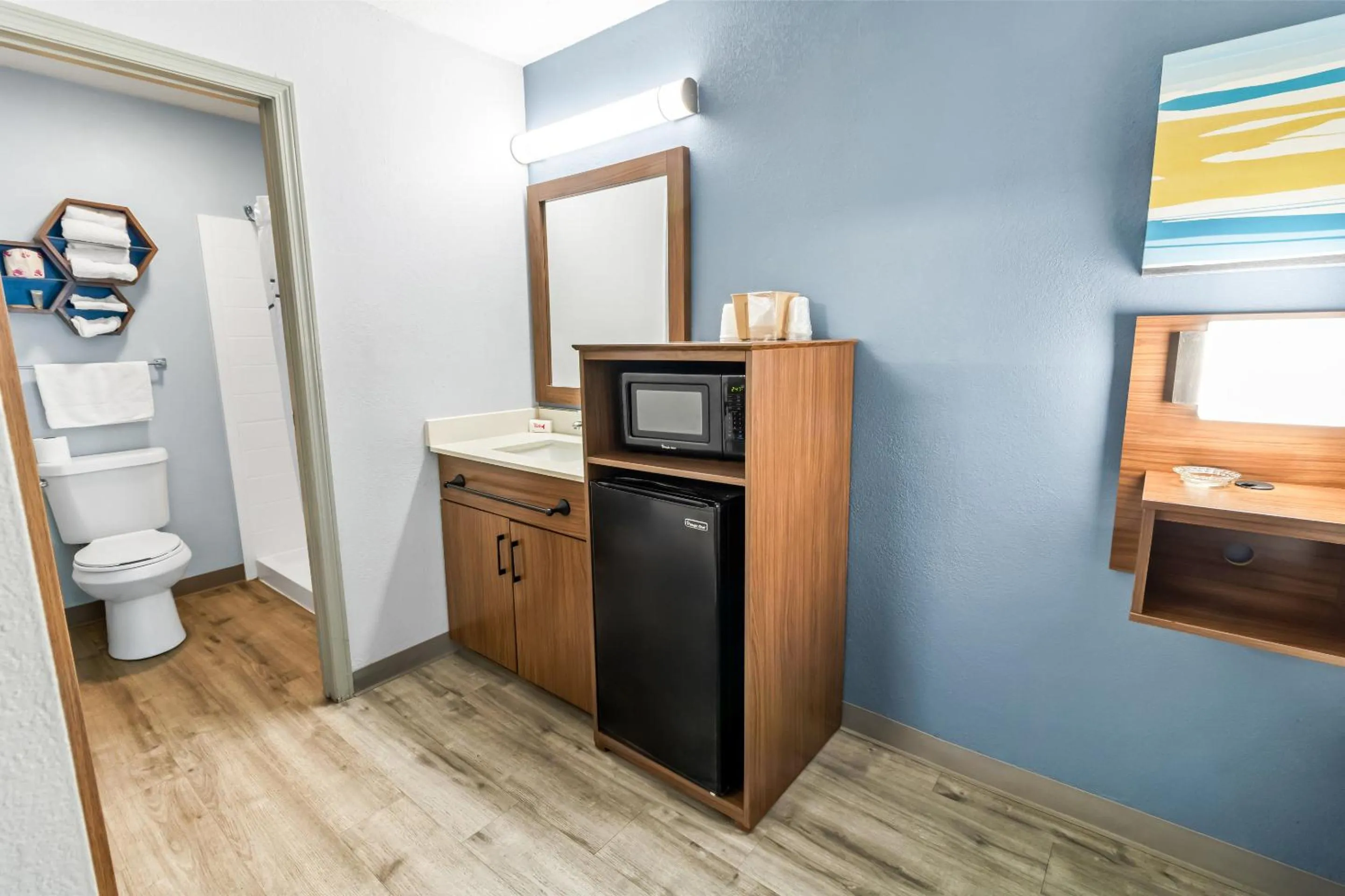 Toilet in HomeTowne Studios by Red Roof Florence, KY-Cincinnati Airport