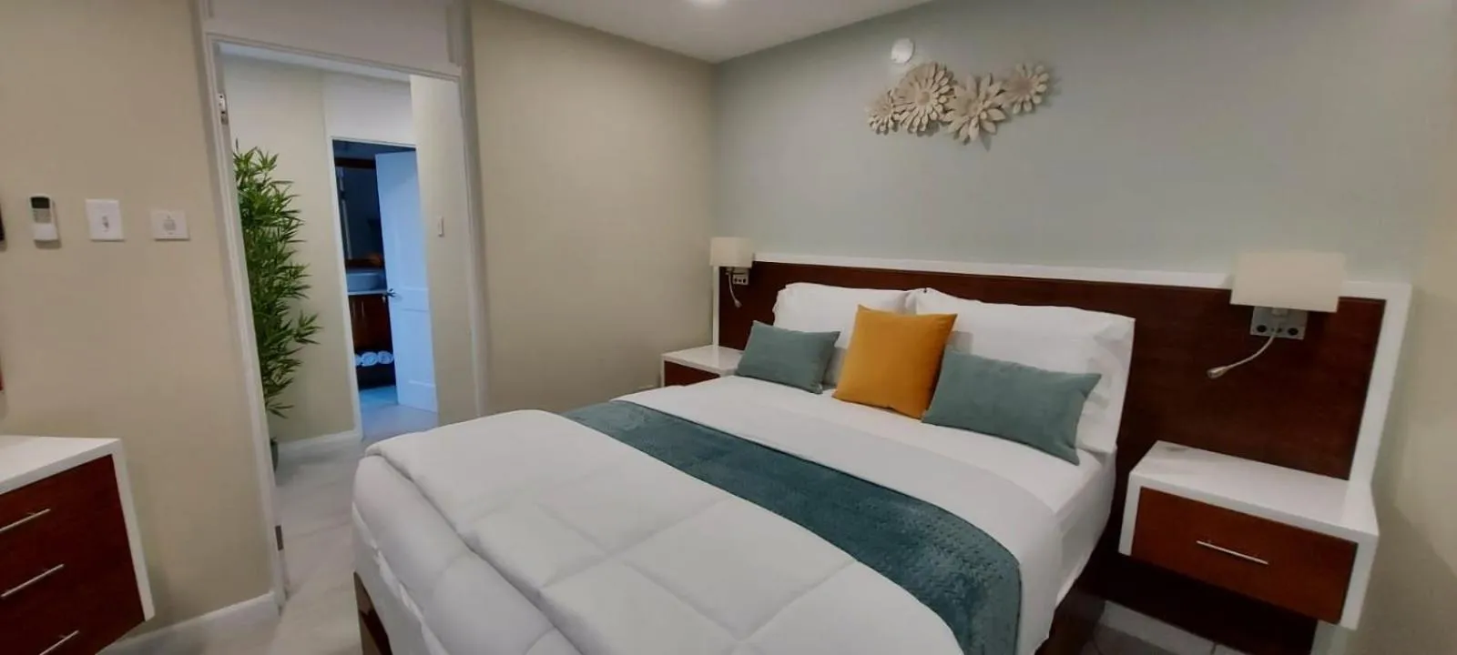 Photo of the whole room, Bed in Almond Grove at Sand Castle